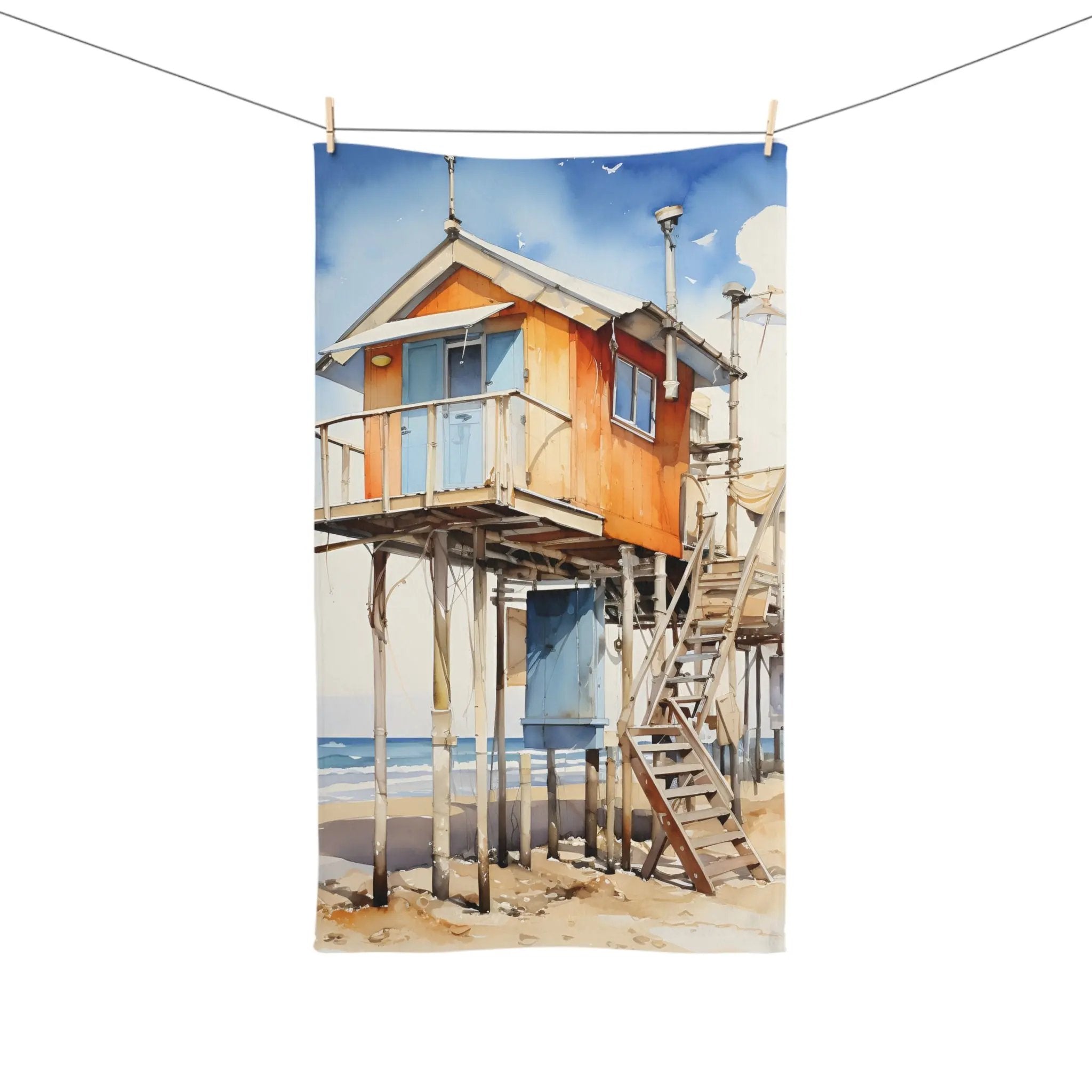 Hand towel | a painting of a house on the beach