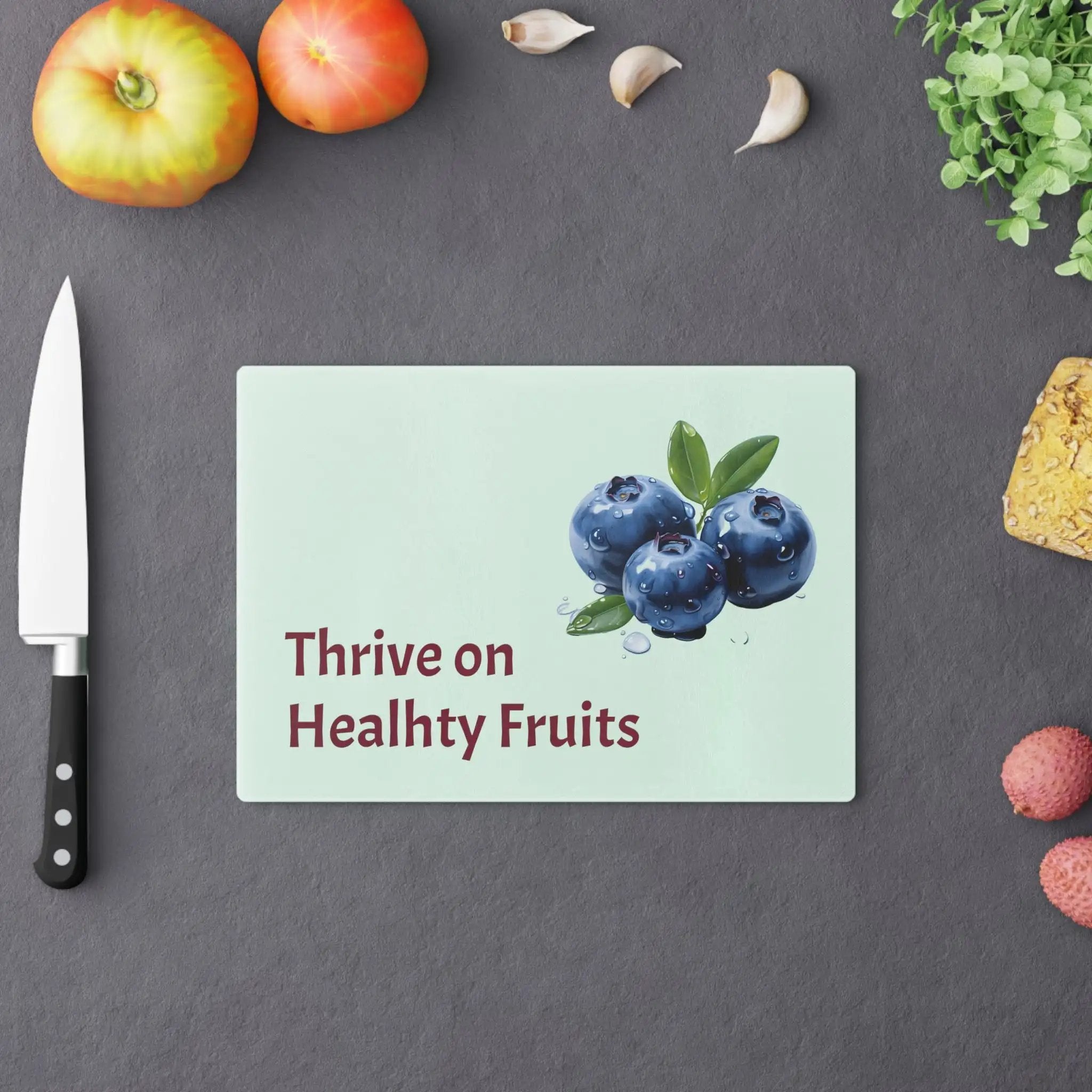 Cutting board | a cutting board with blueberries on it next to a knife