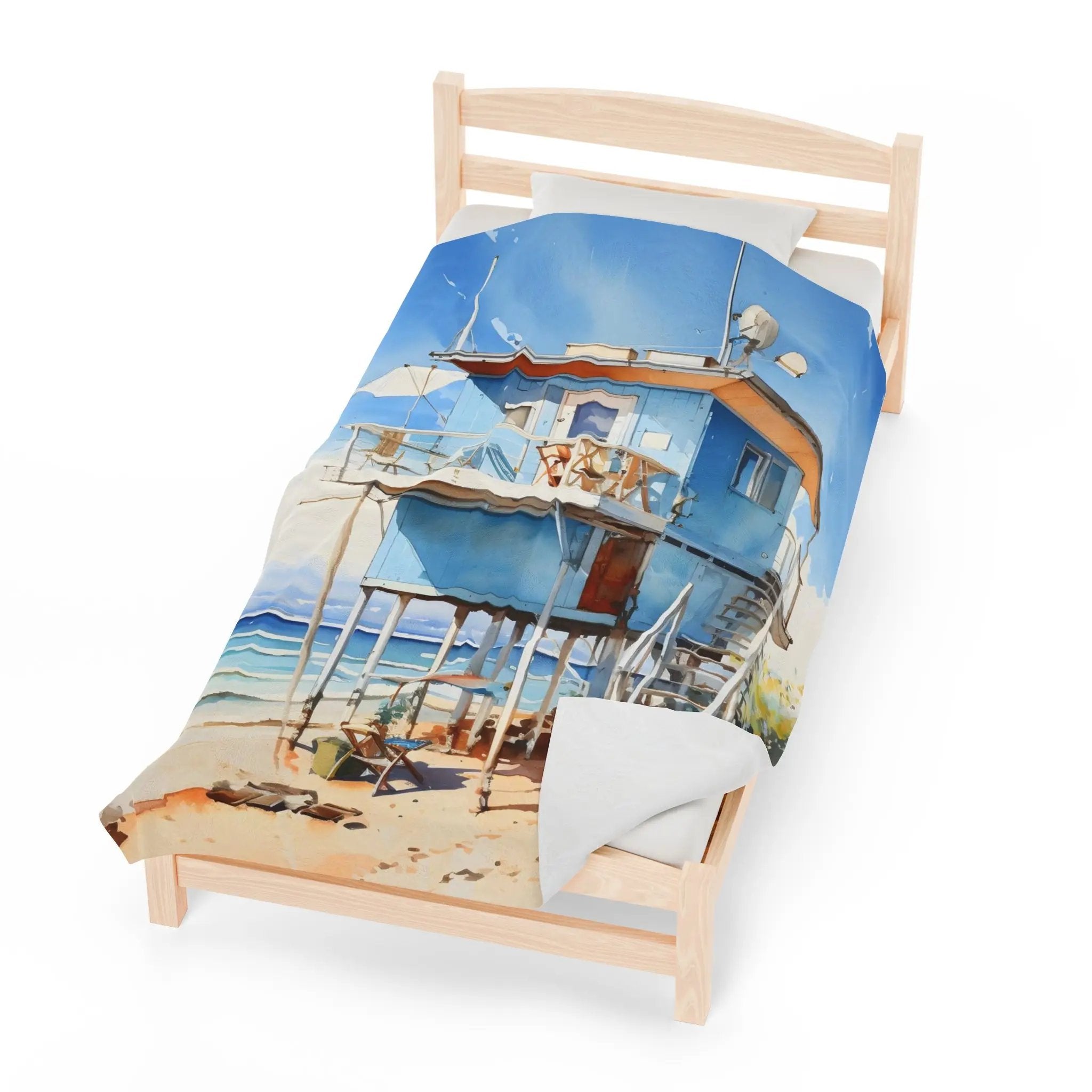 bedroom Blanket | a bed with a picture of a beach cabin on it