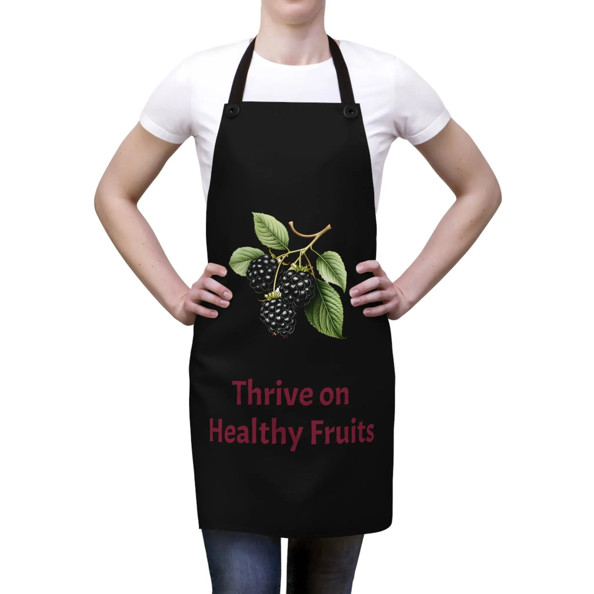 Chef Apron | a woman wearing a black apron with blackberries on it