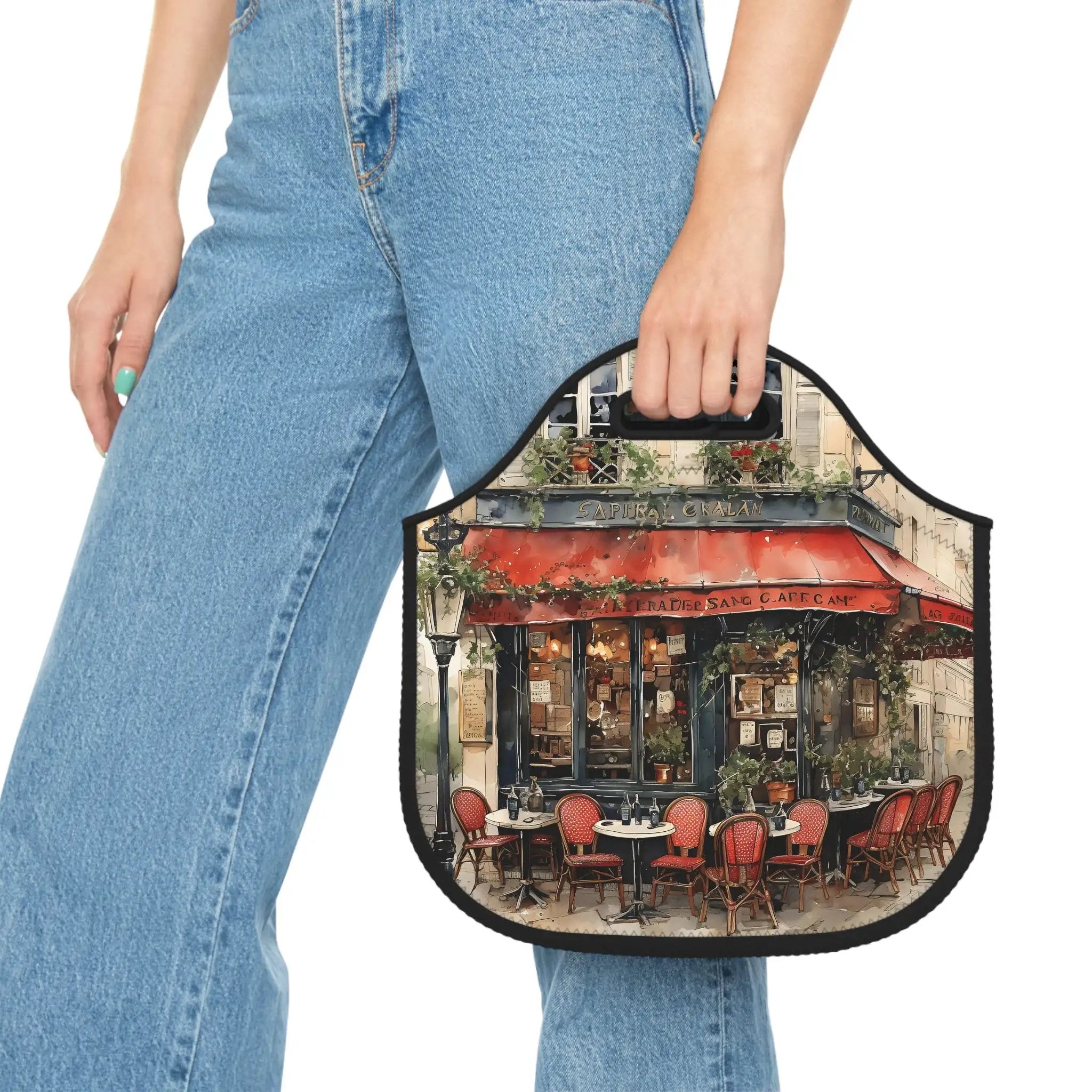 Insulated lunch bag | a woman holding a small purse with a picture of a restaurant on it