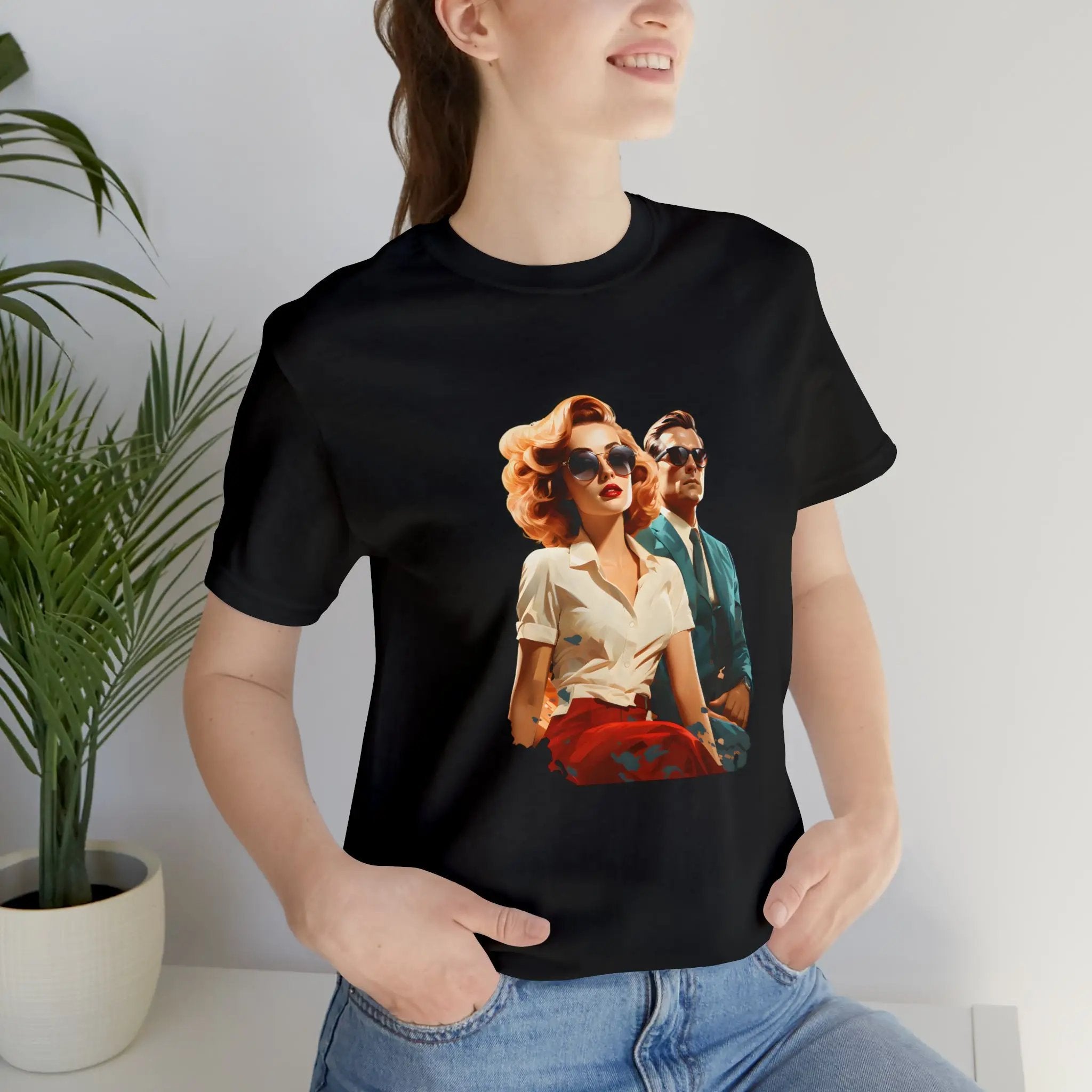 Couple t shirt | a woman wearing a black t - shirt with a picture of a man and woman