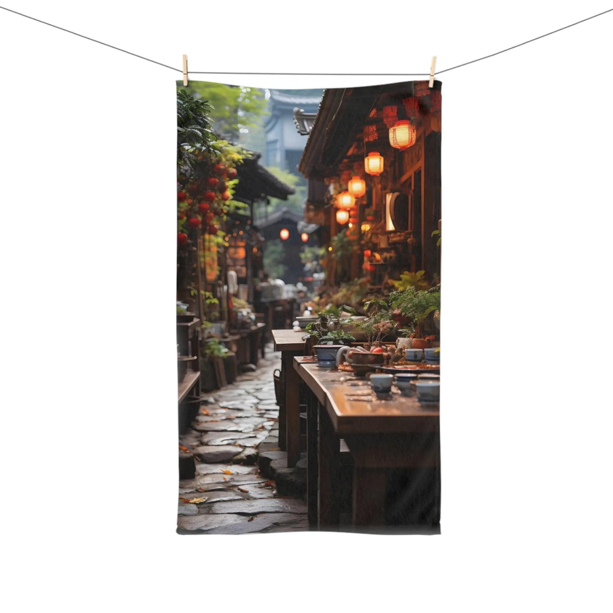 Hand Towel | a picture of a narrow street with lanterns hanging on a clothes line