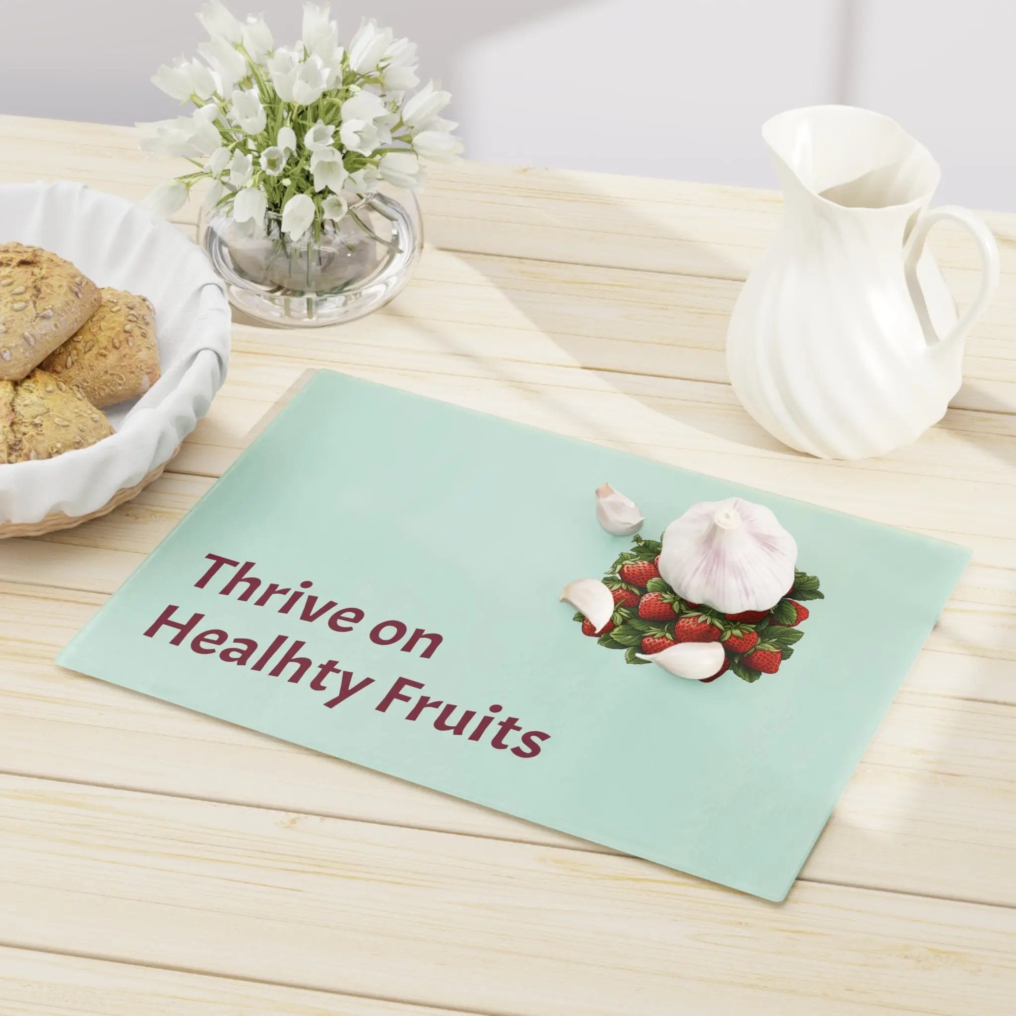 Cutting board | a table topped with a bowl of cookies and a plate of cookies