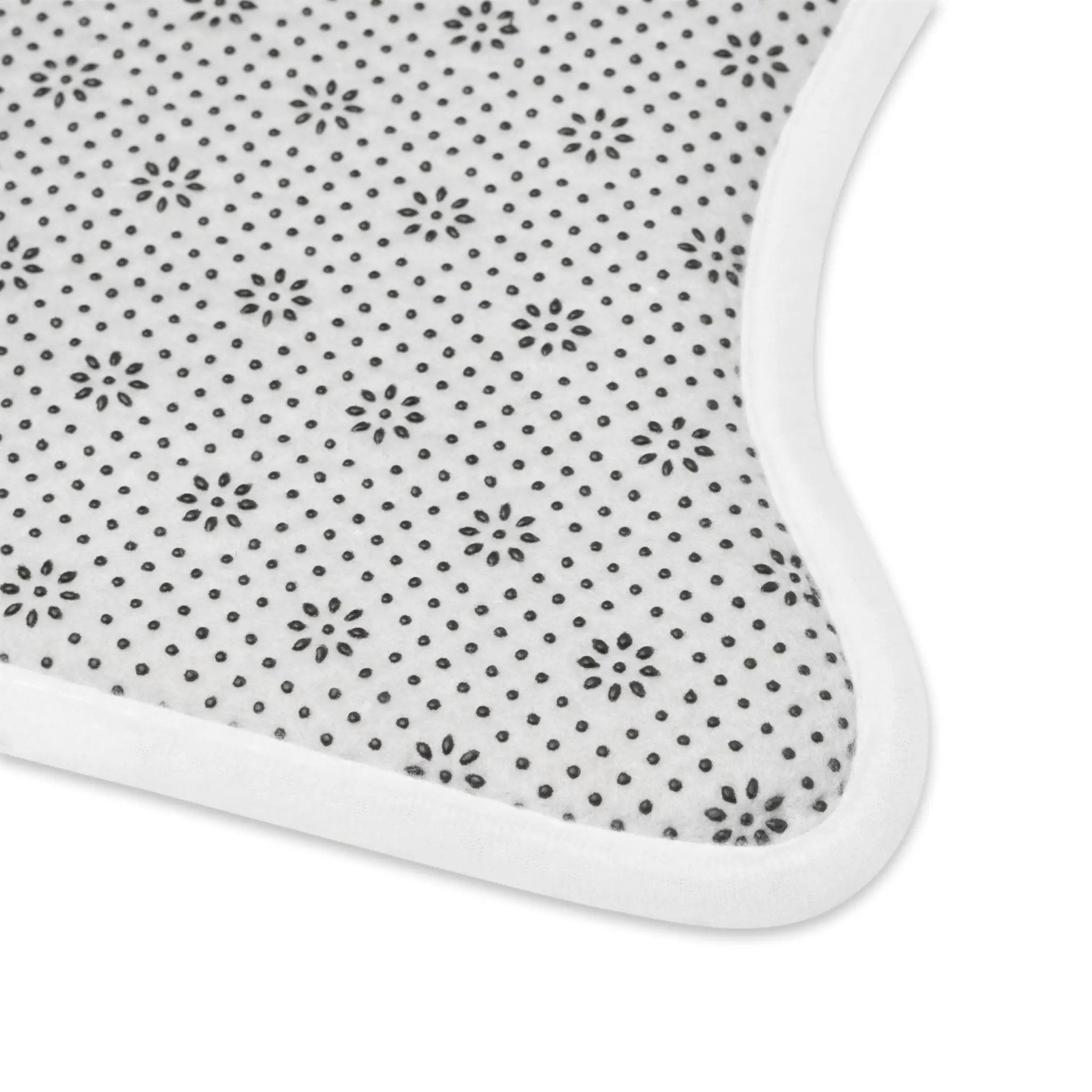 Pet Feeding Mats | a white mat with black dots on it