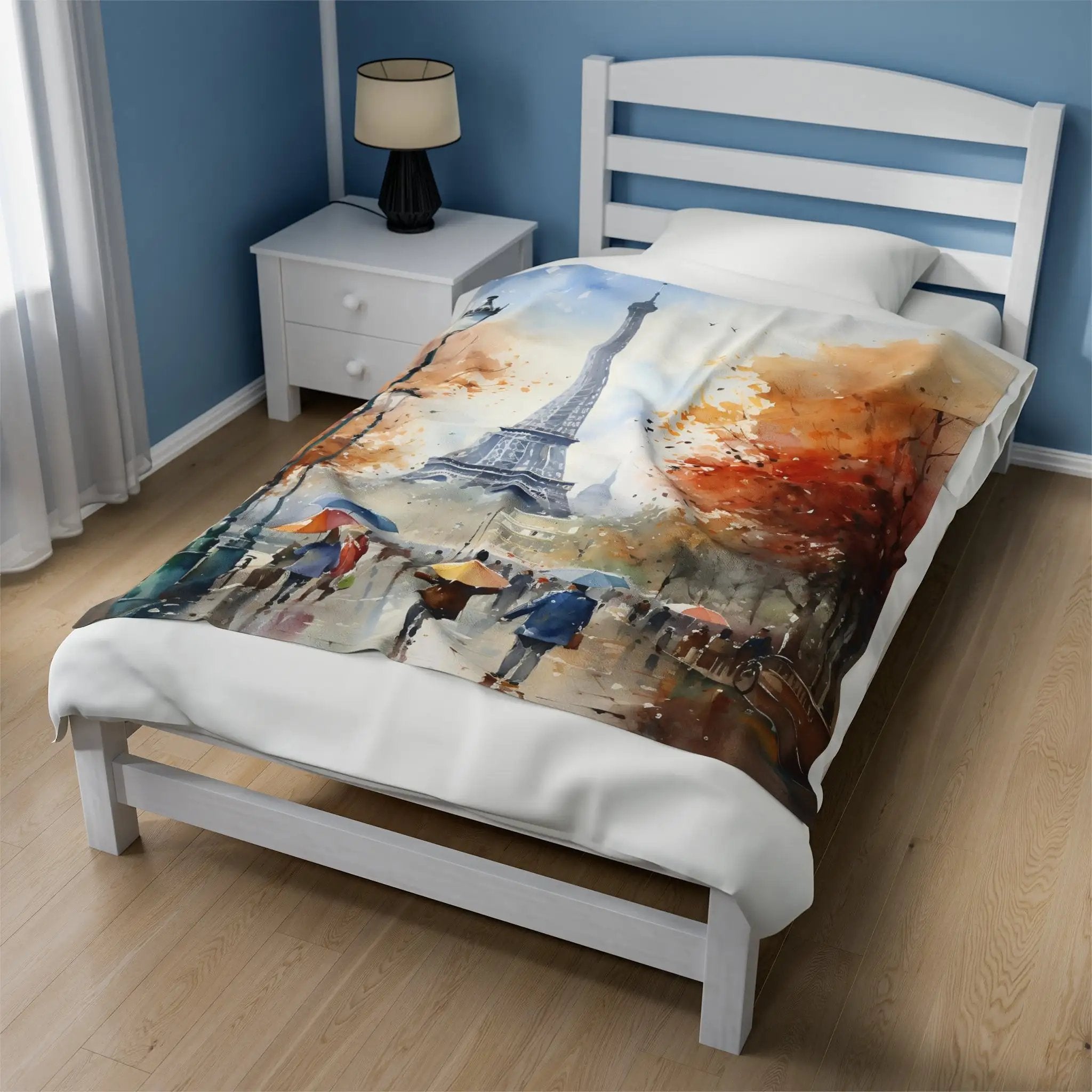 bedroom Blanket | a bed with a painting of the Eiffel tower on it