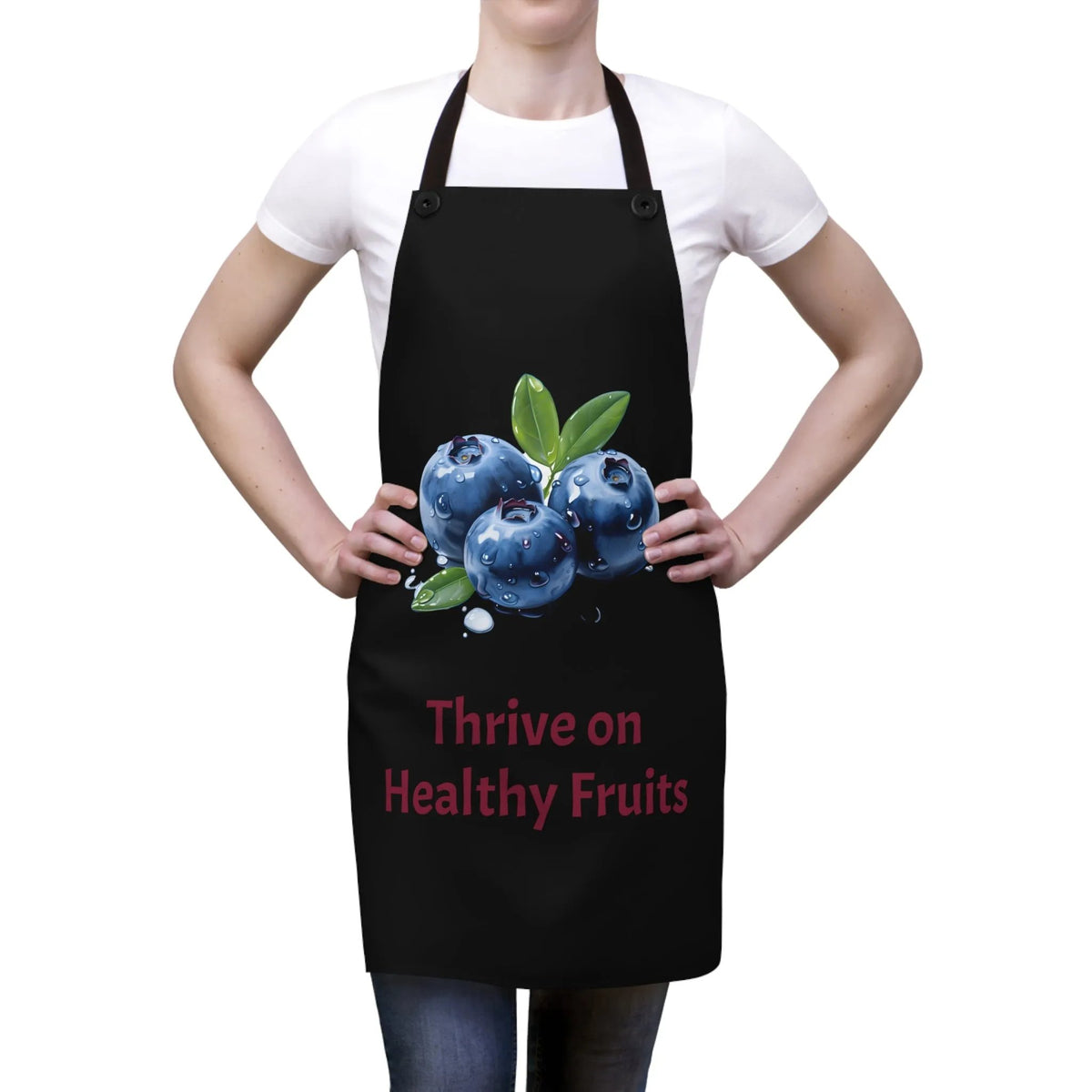 Chef Apron | a woman wearing a black apron with blueberries on it