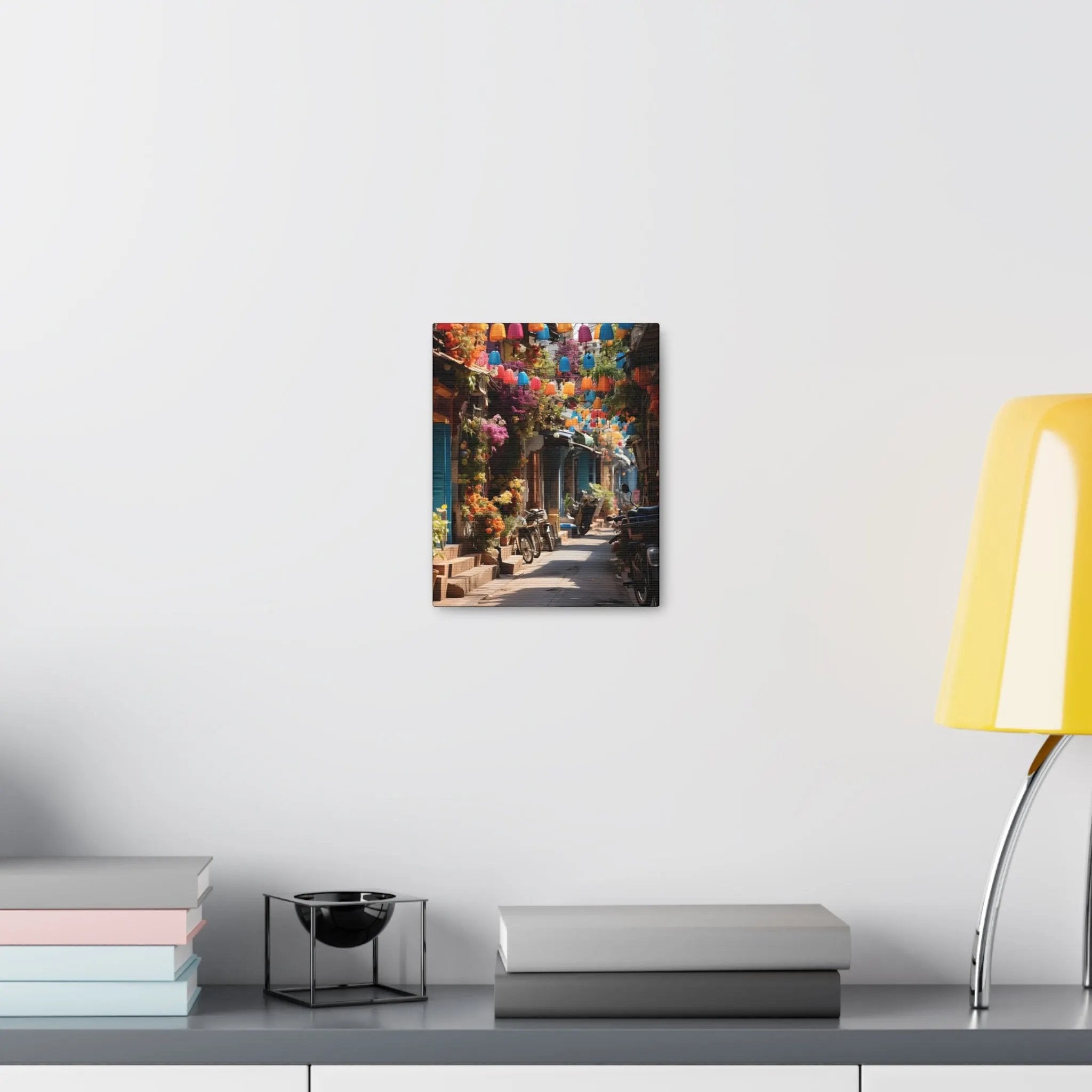 Canvas Gallery Wraps | a table with a lamp and some books on it