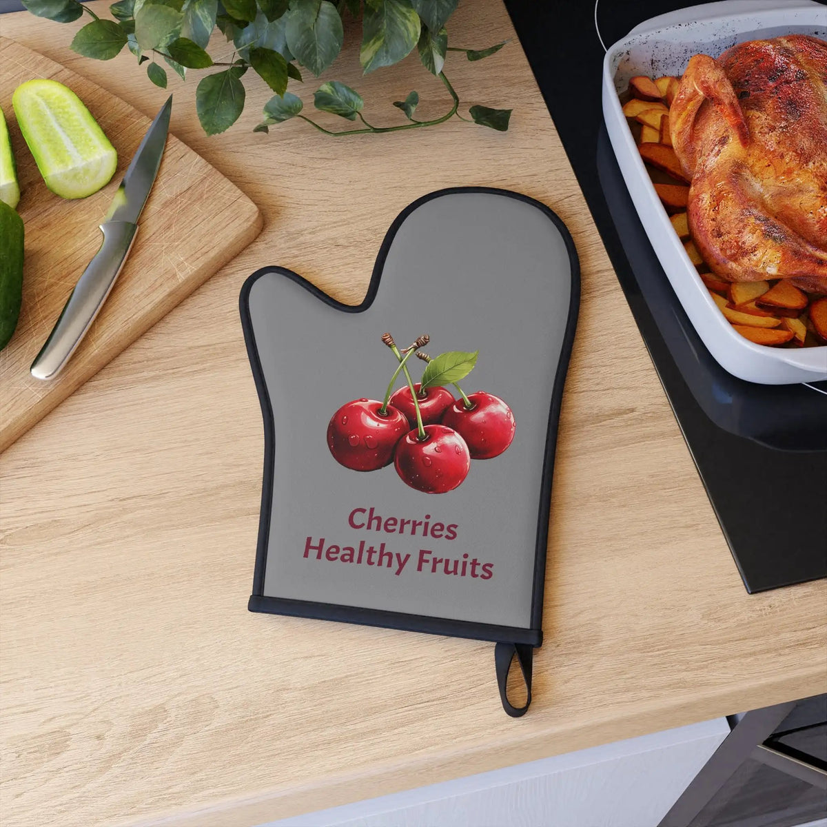 oven mitt | a wooden table topped with a cutting board and a tray of food