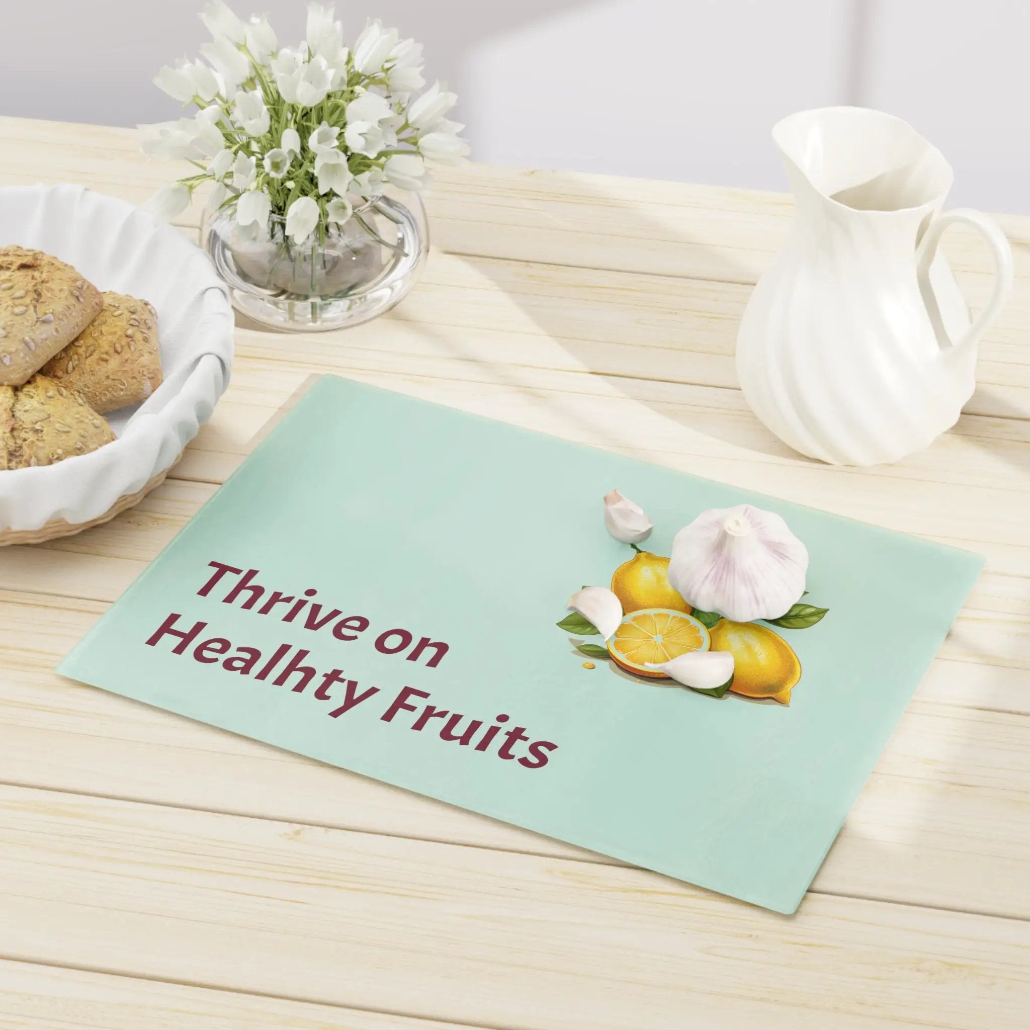 Cutting board | a table topped with a bowl of cookies and a plate of cookies