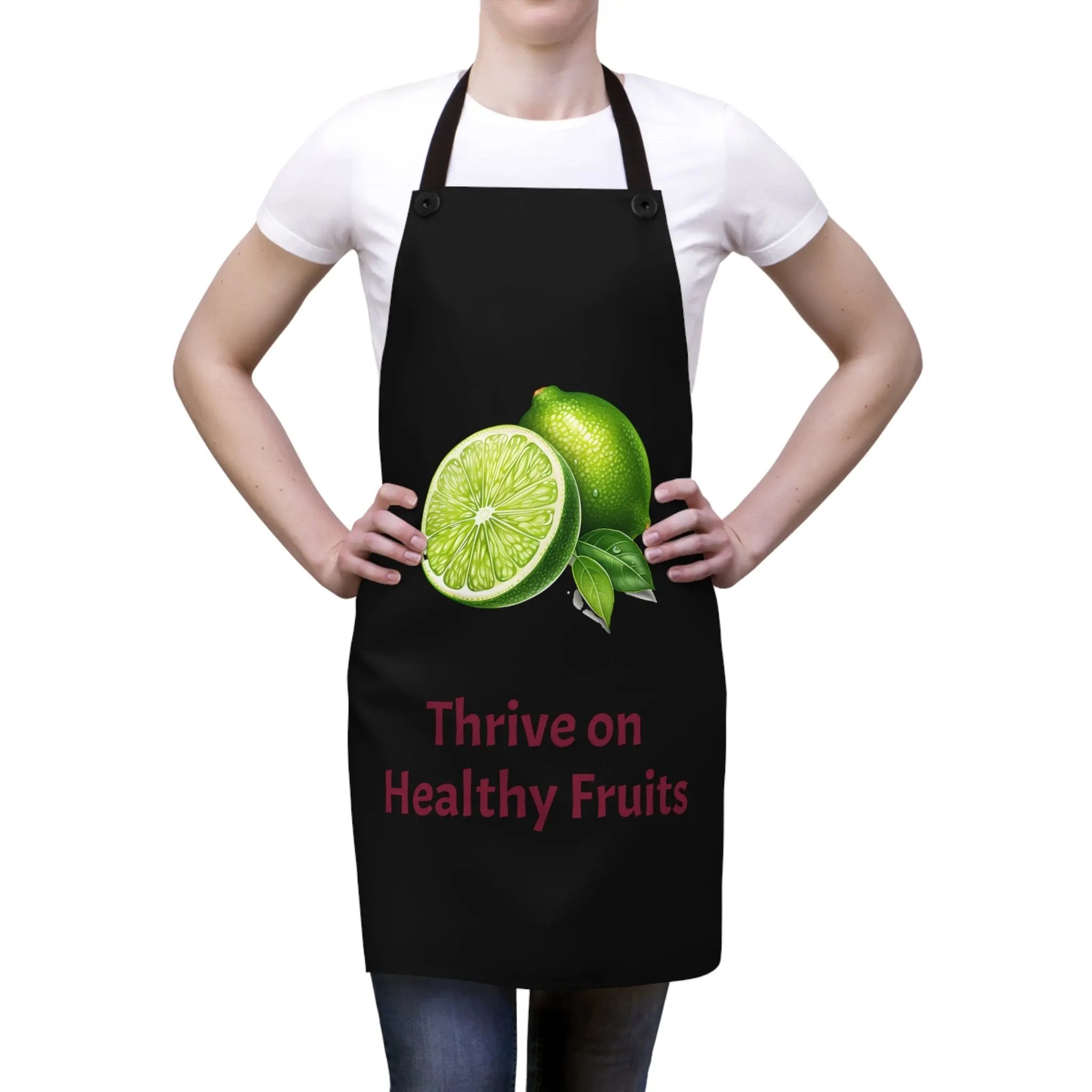 Chef Apron | a woman wearing a black apron with a green apple on it