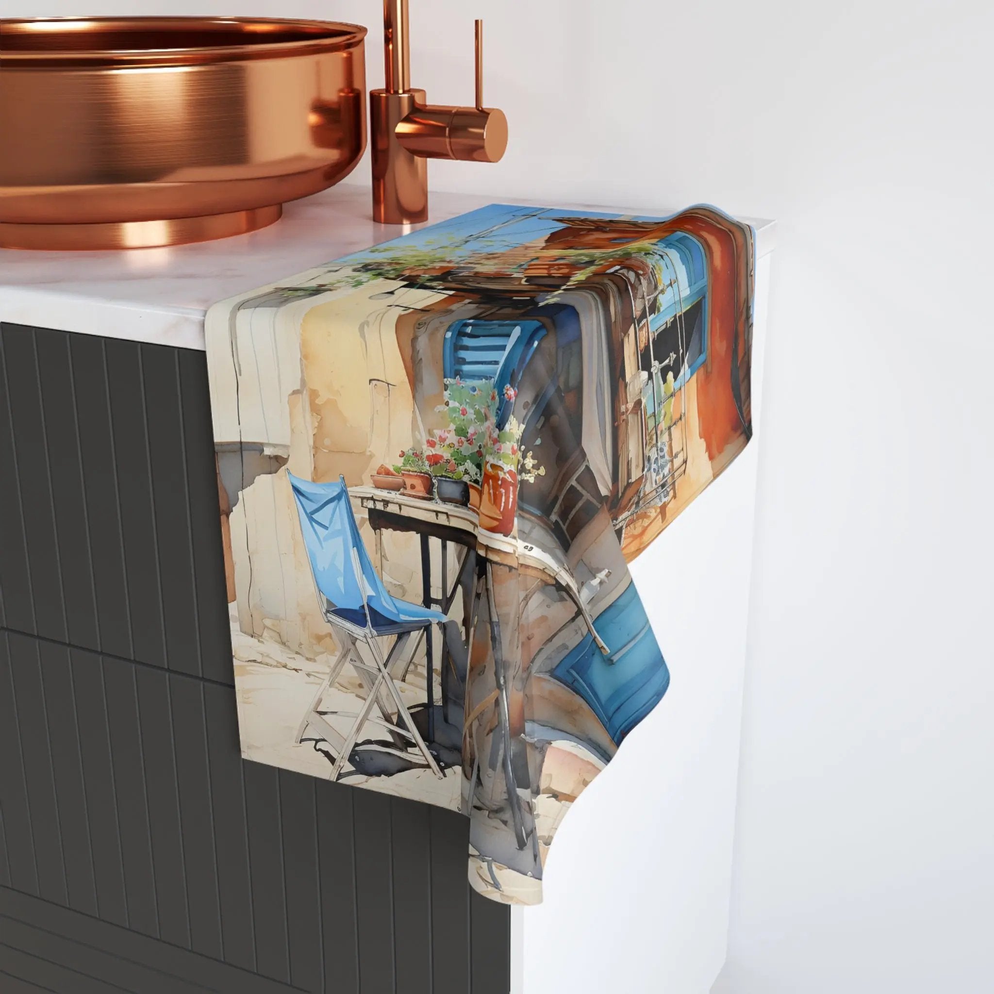 Hand towel | a kitchen counter with a copper sink and copper faucet