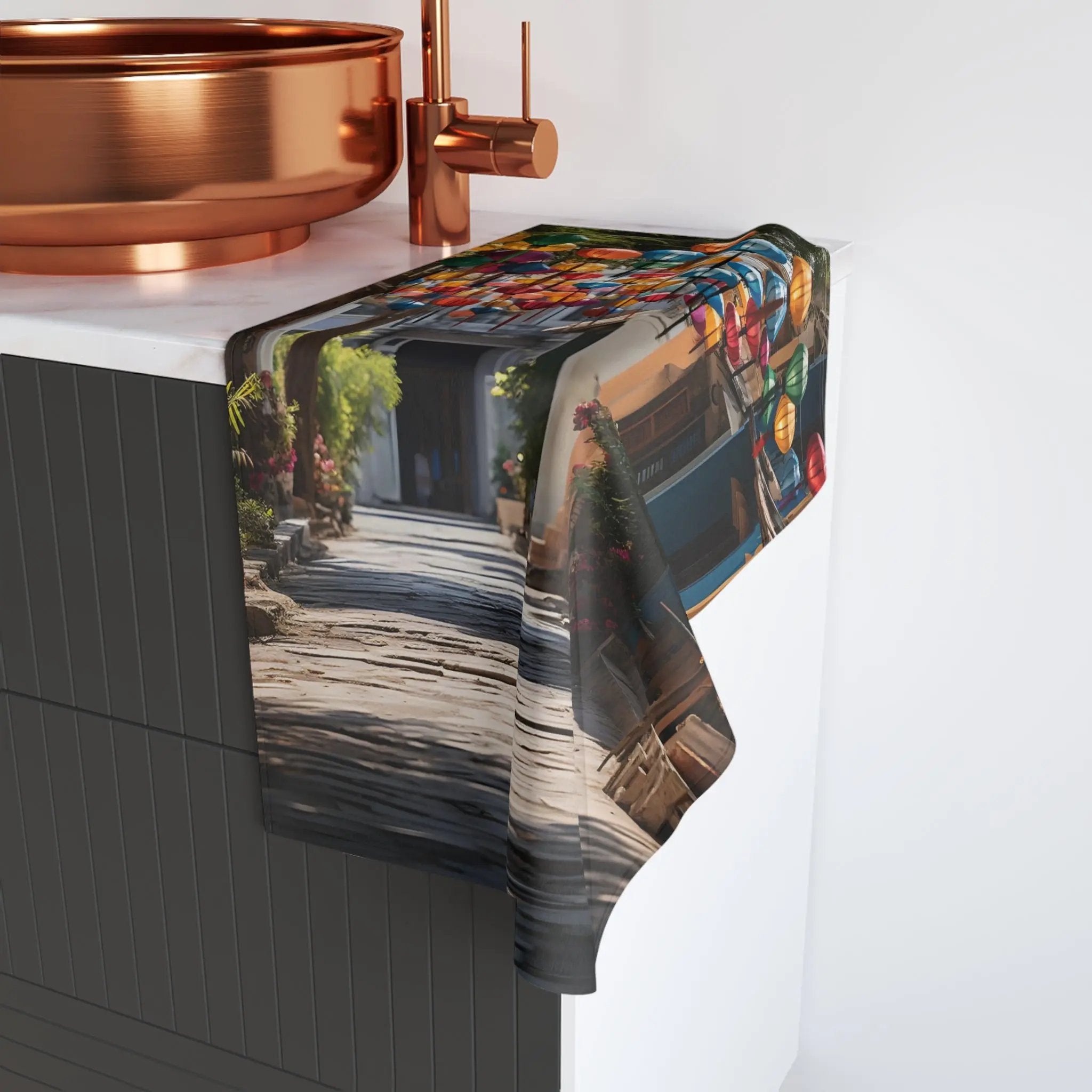 Hand towel | a kitchen counter with a sink and a copper bowl