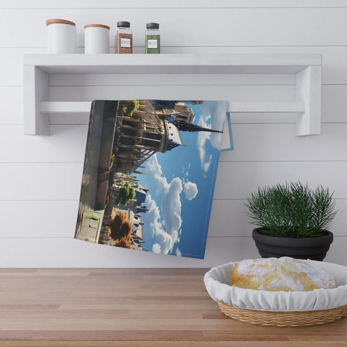 Kitchen Towel | a picture of a building is hanging on a wall