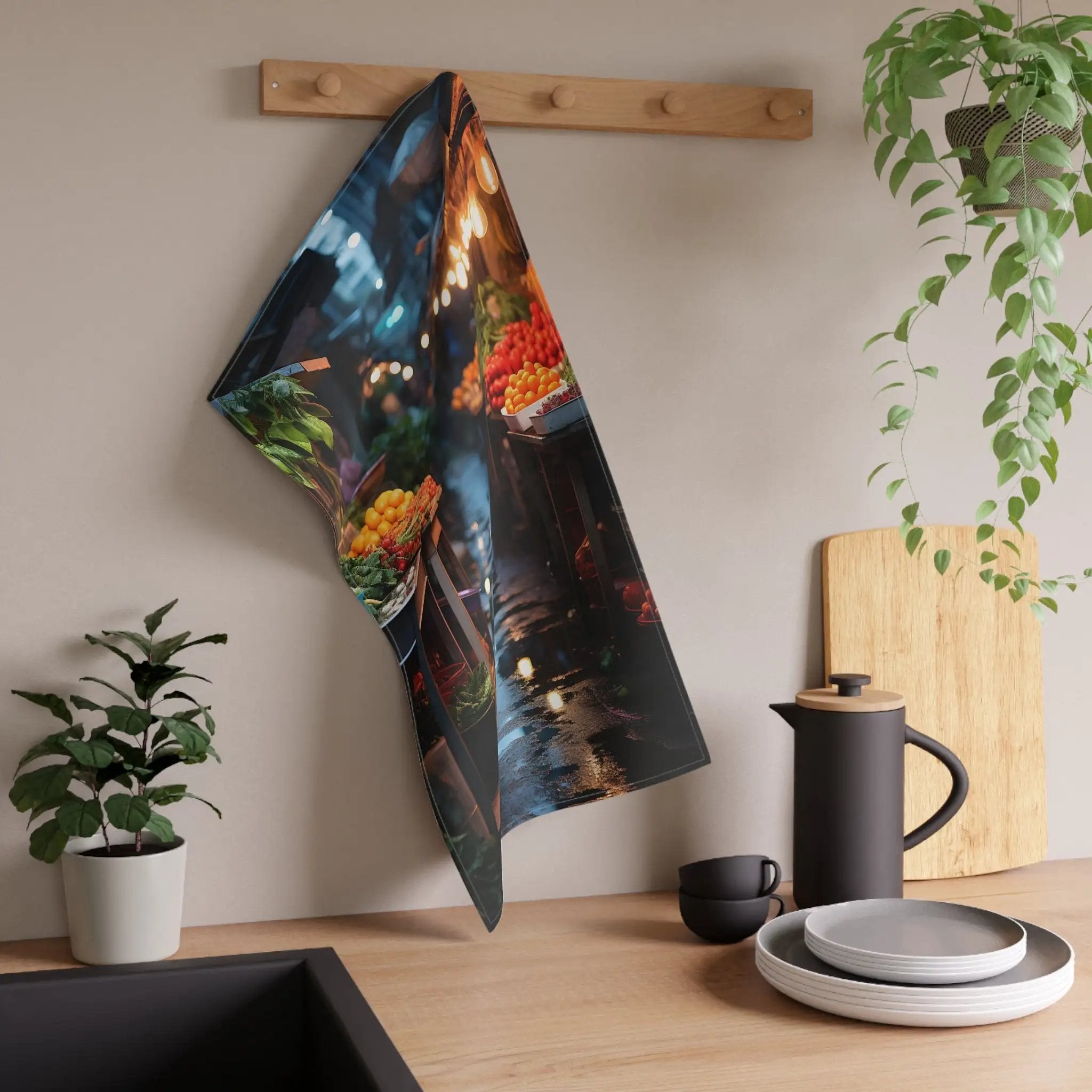 Kitchen Towel | a tea towel hanging on a wall next to a potted plant