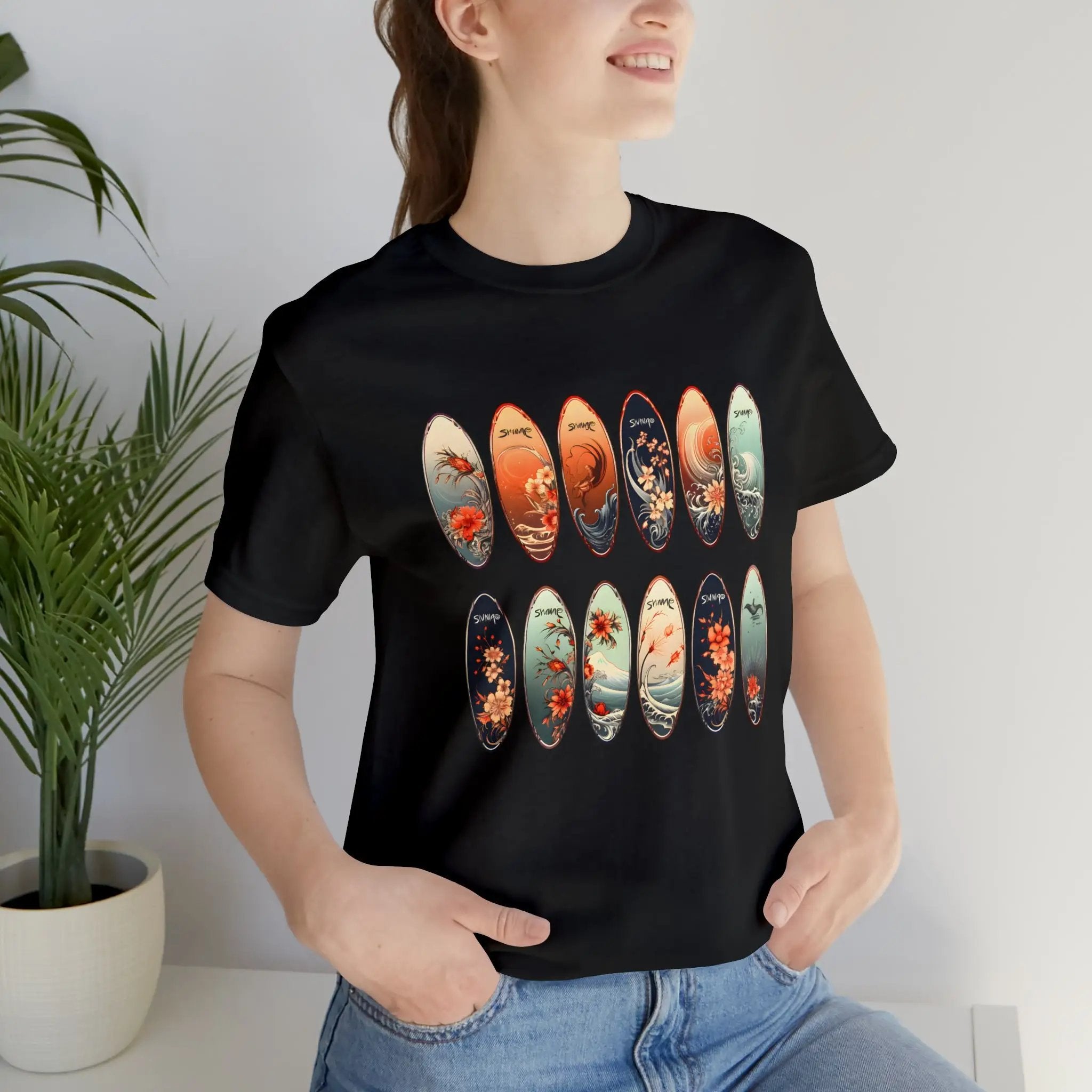 Couple t shirt | a woman wearing a black t - shirt with a bunch of surfboards on it