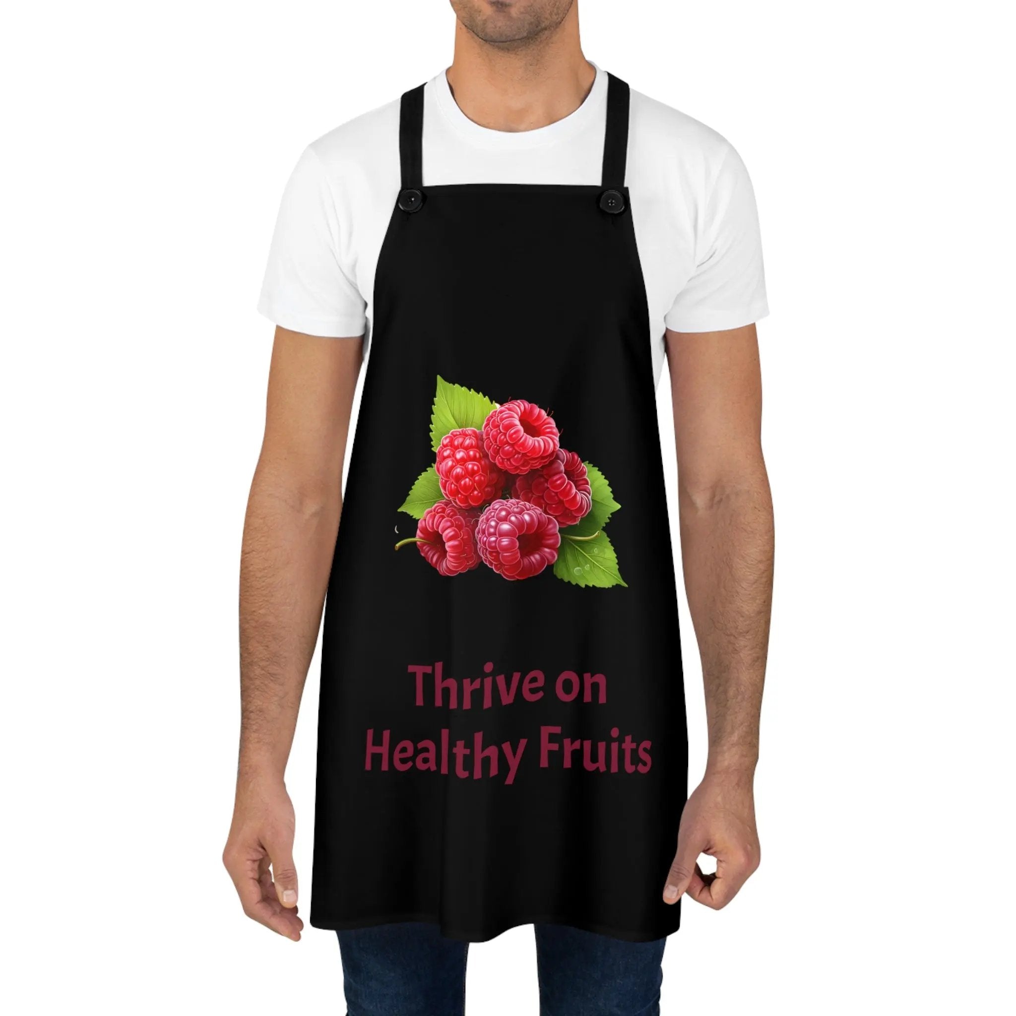 Chef Apron | a man wearing a black apron with raspberries on it