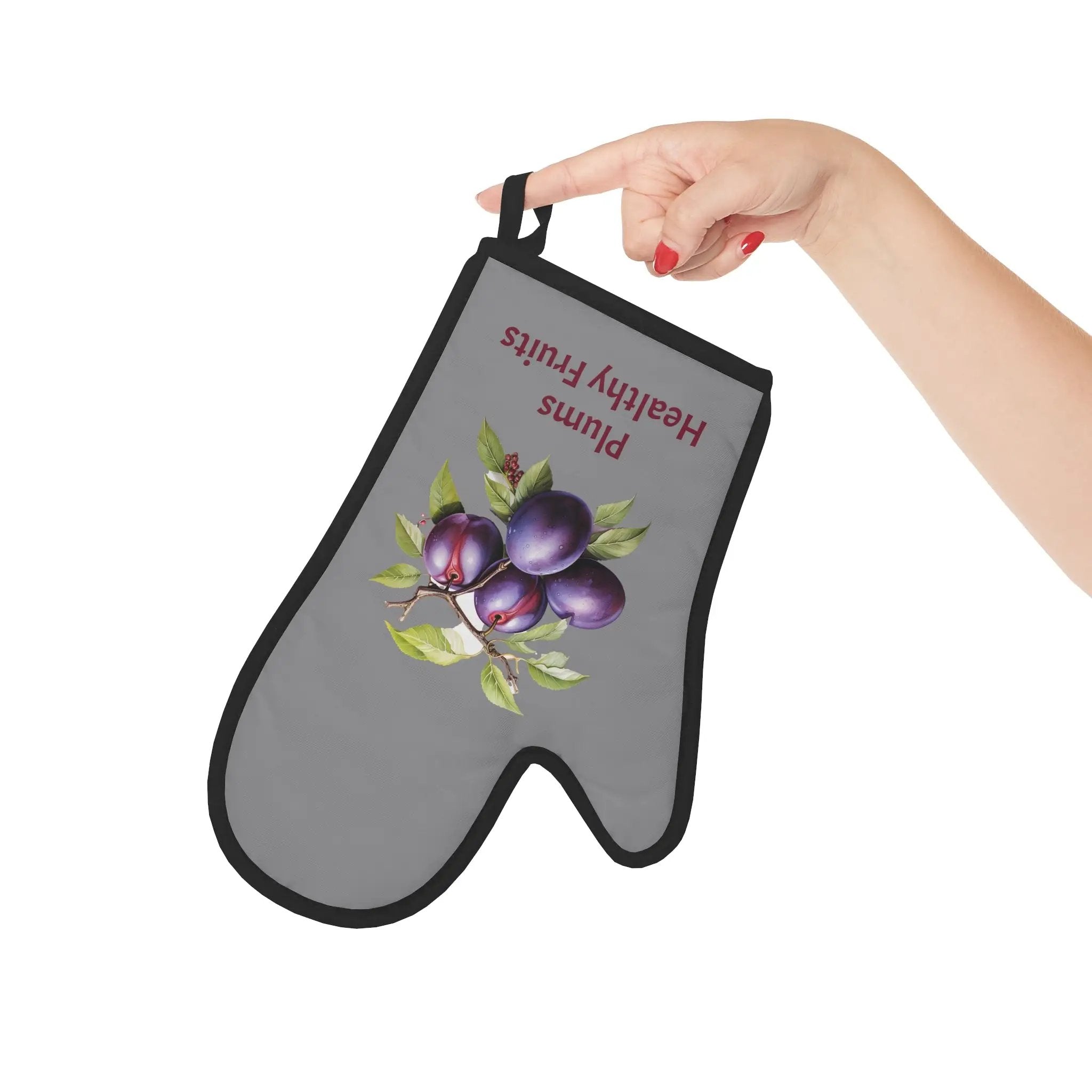 oven mitt | a hand holding a oven mitt with a picture of plums on it