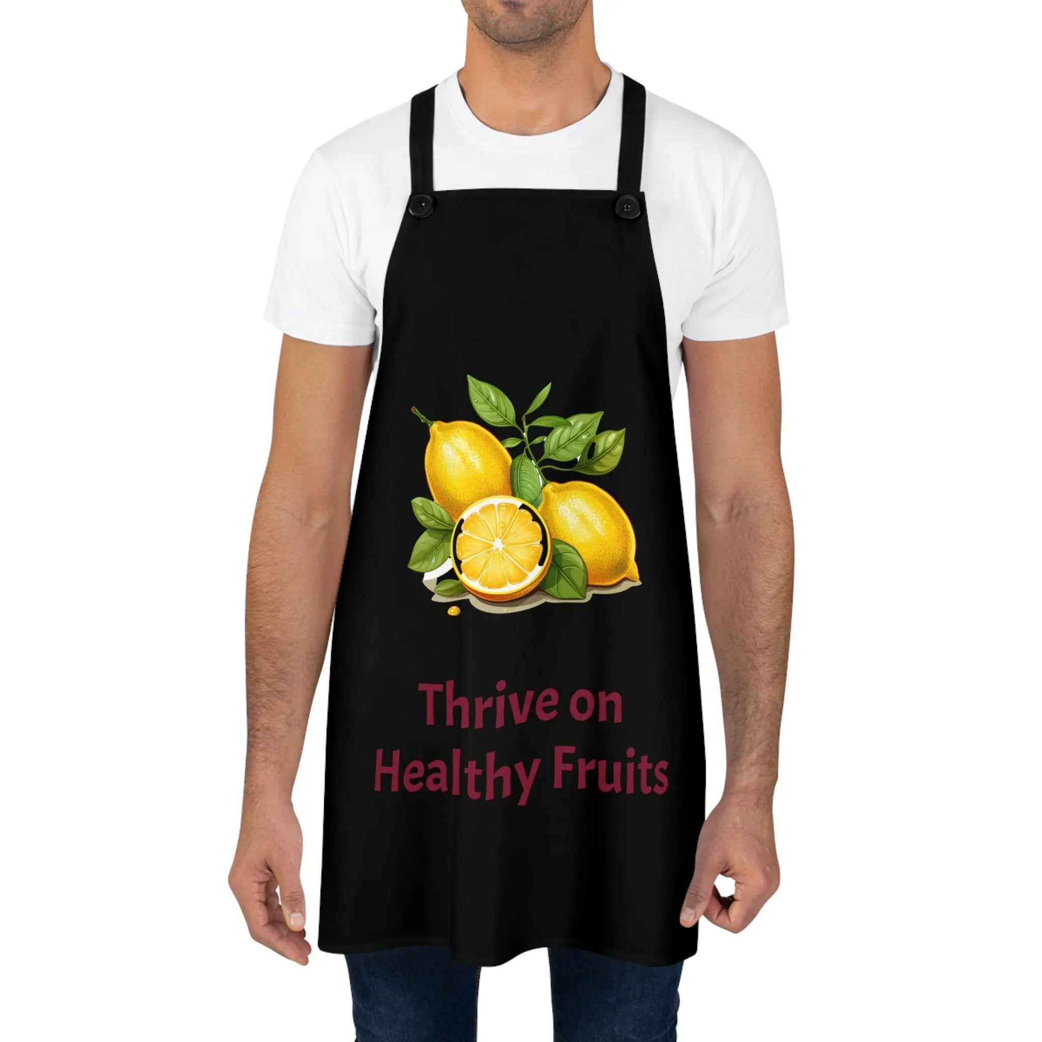 Chef Apron | a man wearing a black apron with lemons on it