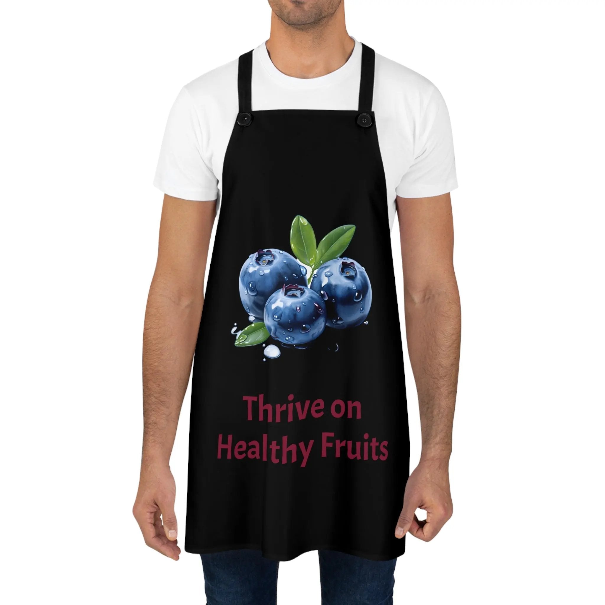 Chef Apron | a man wearing a black apron with blueberries on it