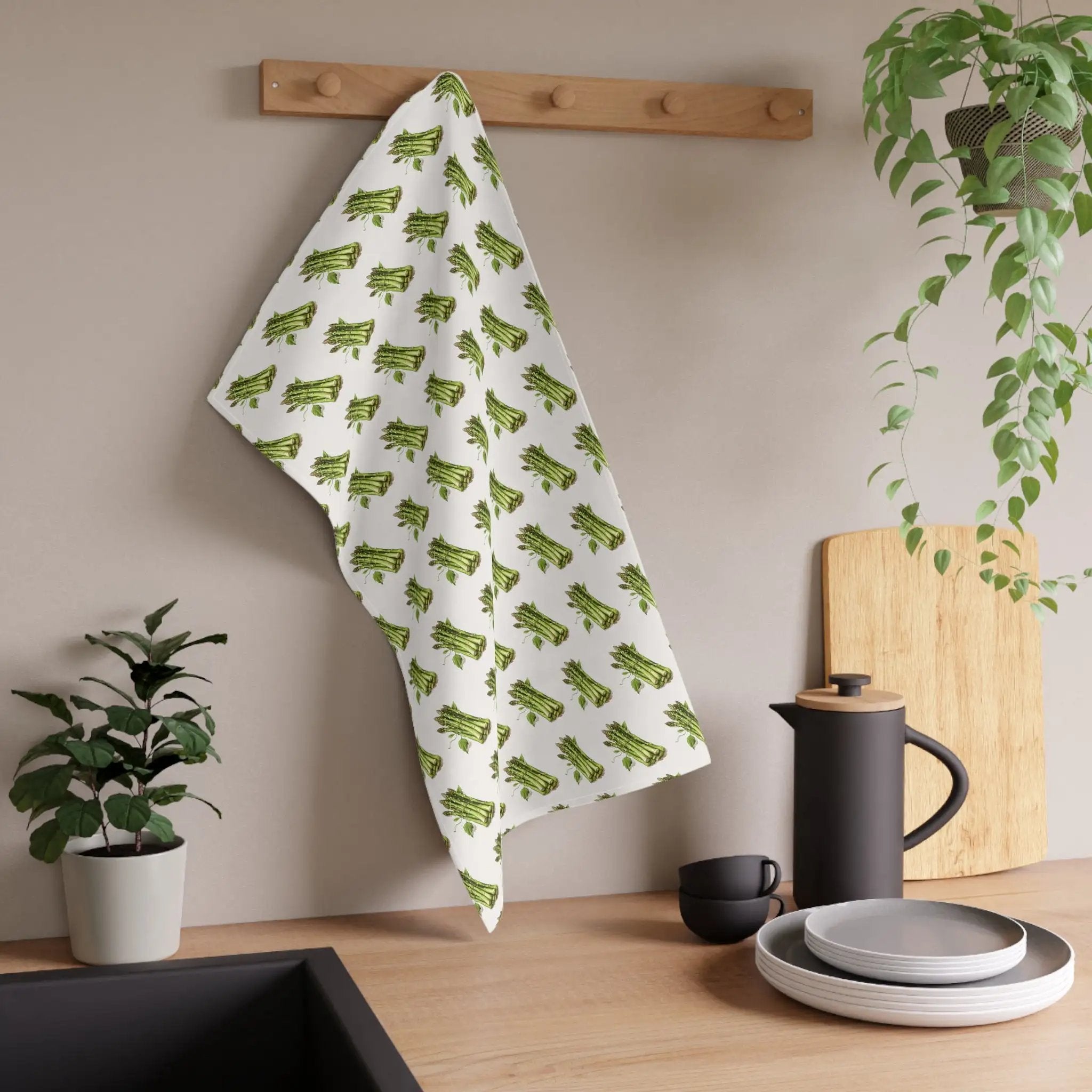 Kitchen Towel | a kitchen with a potted plant and a towel hanging on the wall