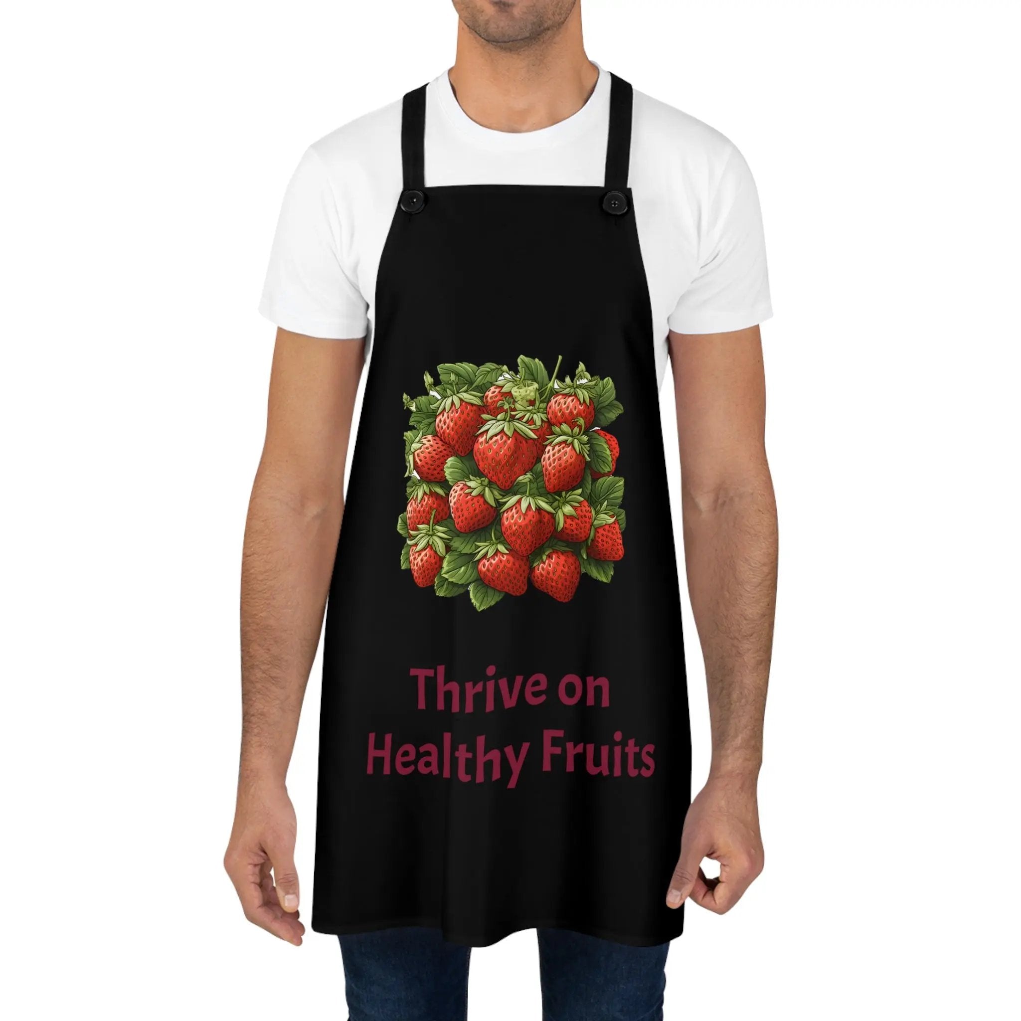 Chef Apron | a man wearing a black apron with strawberries on it