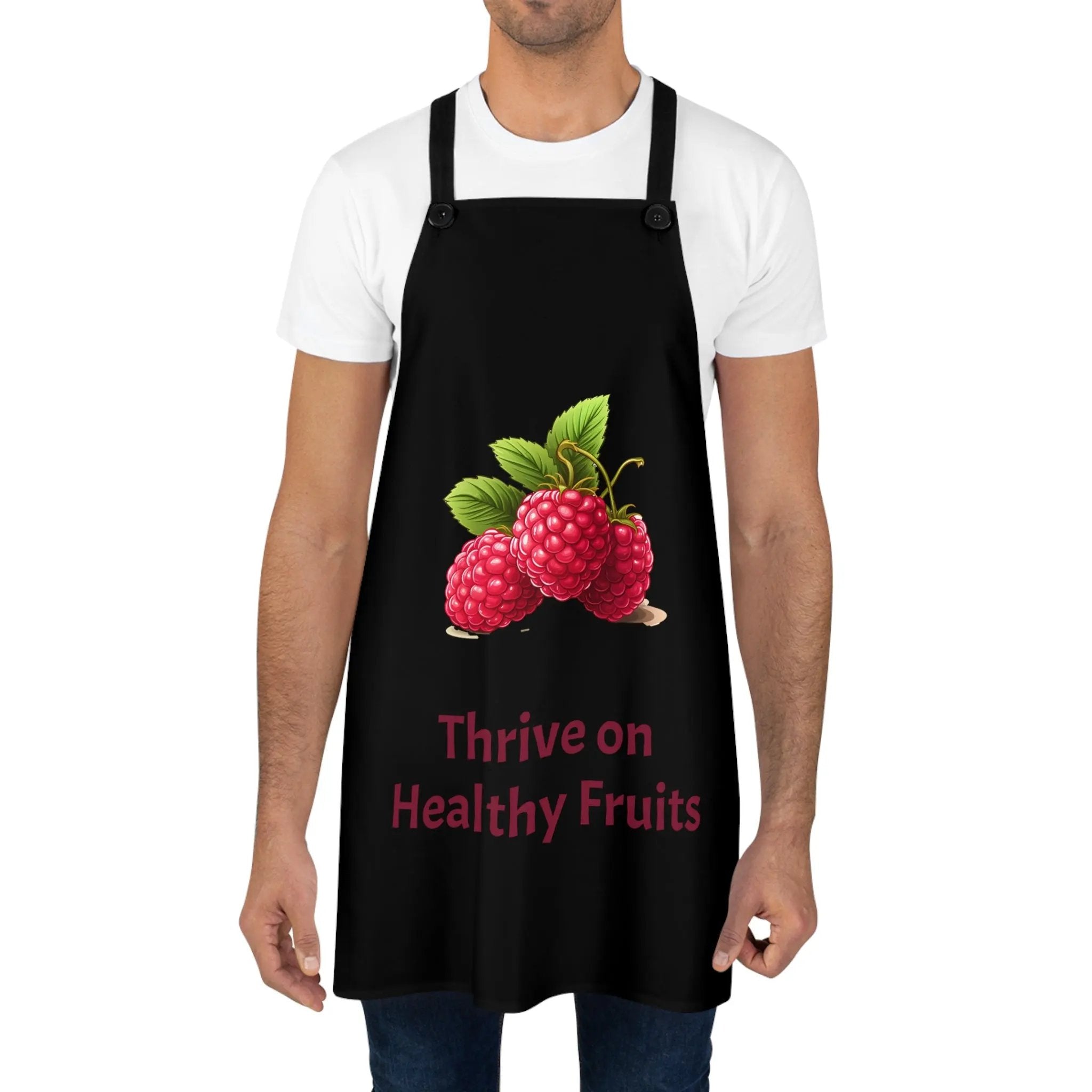 Chef Apron | a man wearing a black apron with raspberries on it