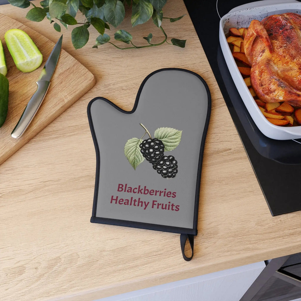 oven mitt | a wooden table topped with a cutting board and a tray of food