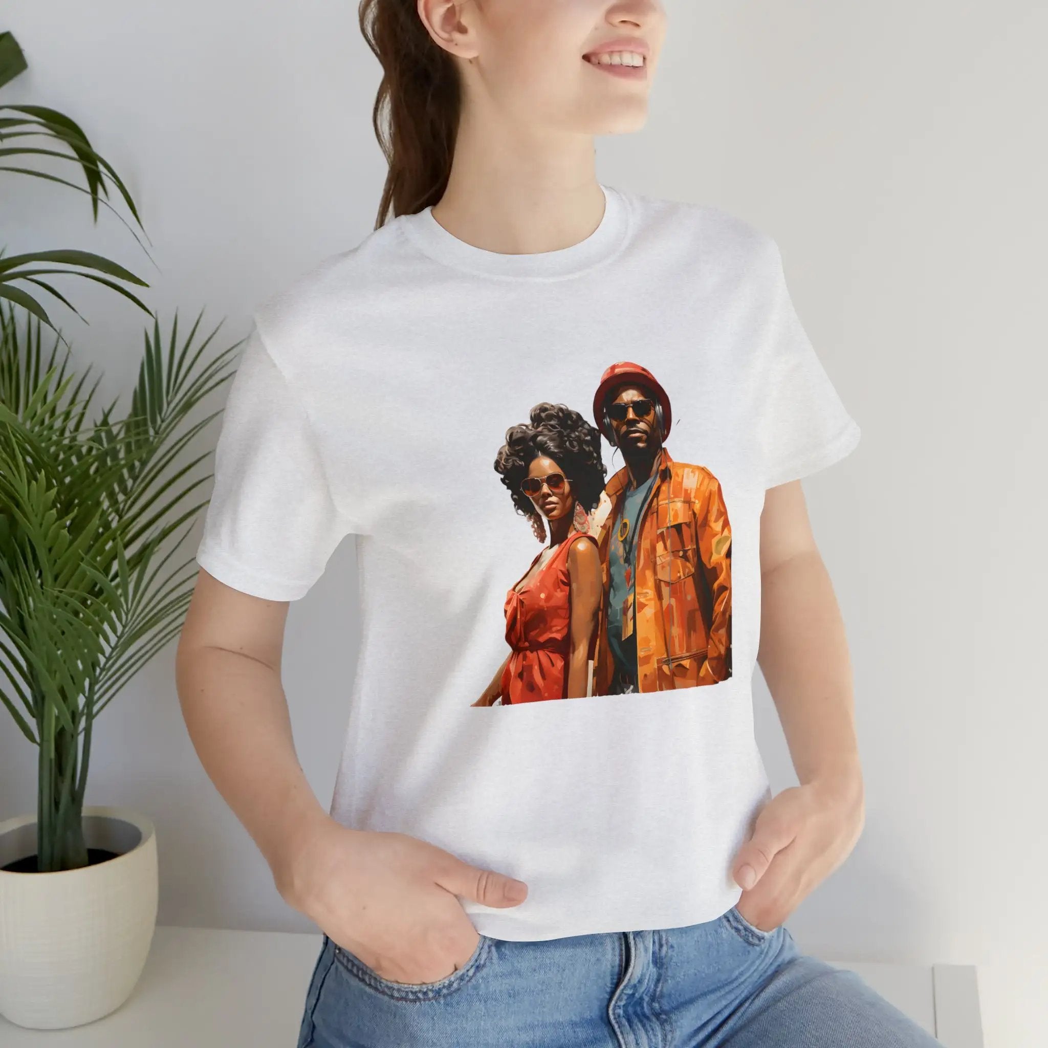 Couple t shirt | a woman wearing a white t - shirt with a picture of two people on it