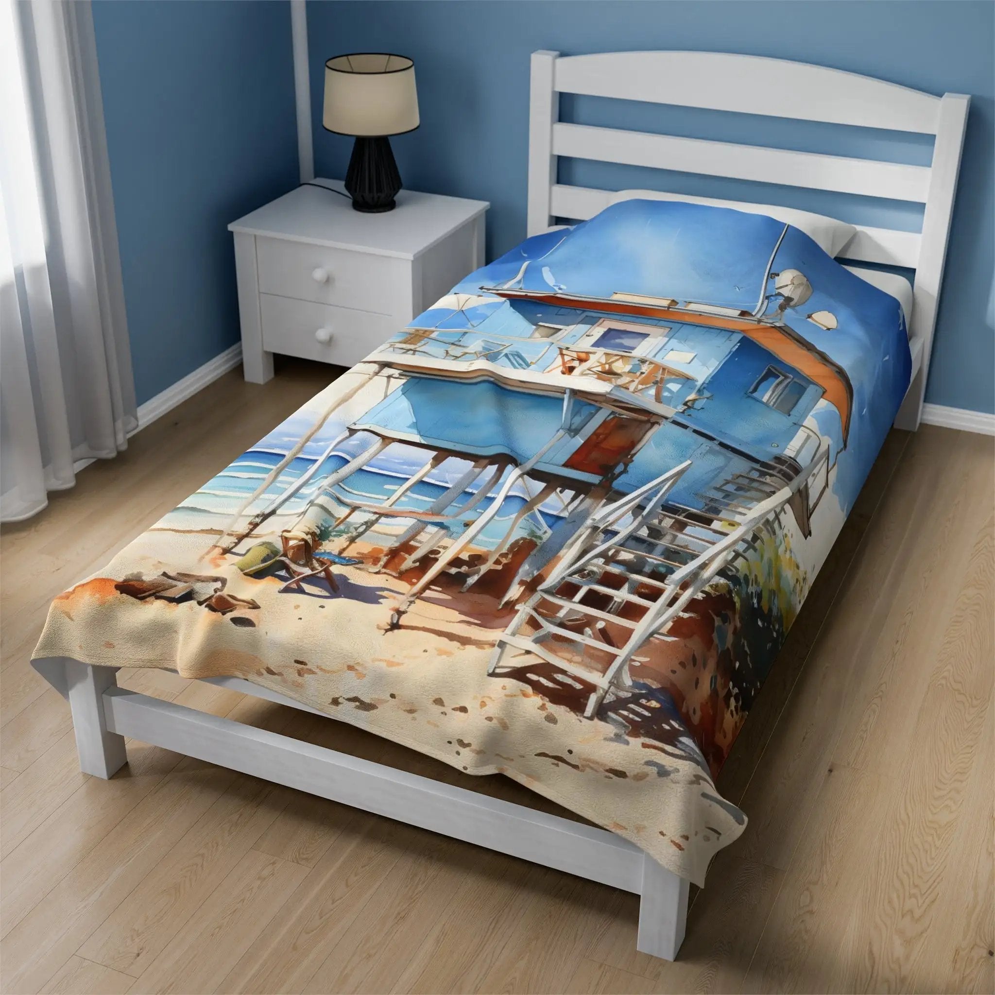 bedroom Blanket | a bed with a picture of a beach cabin on it