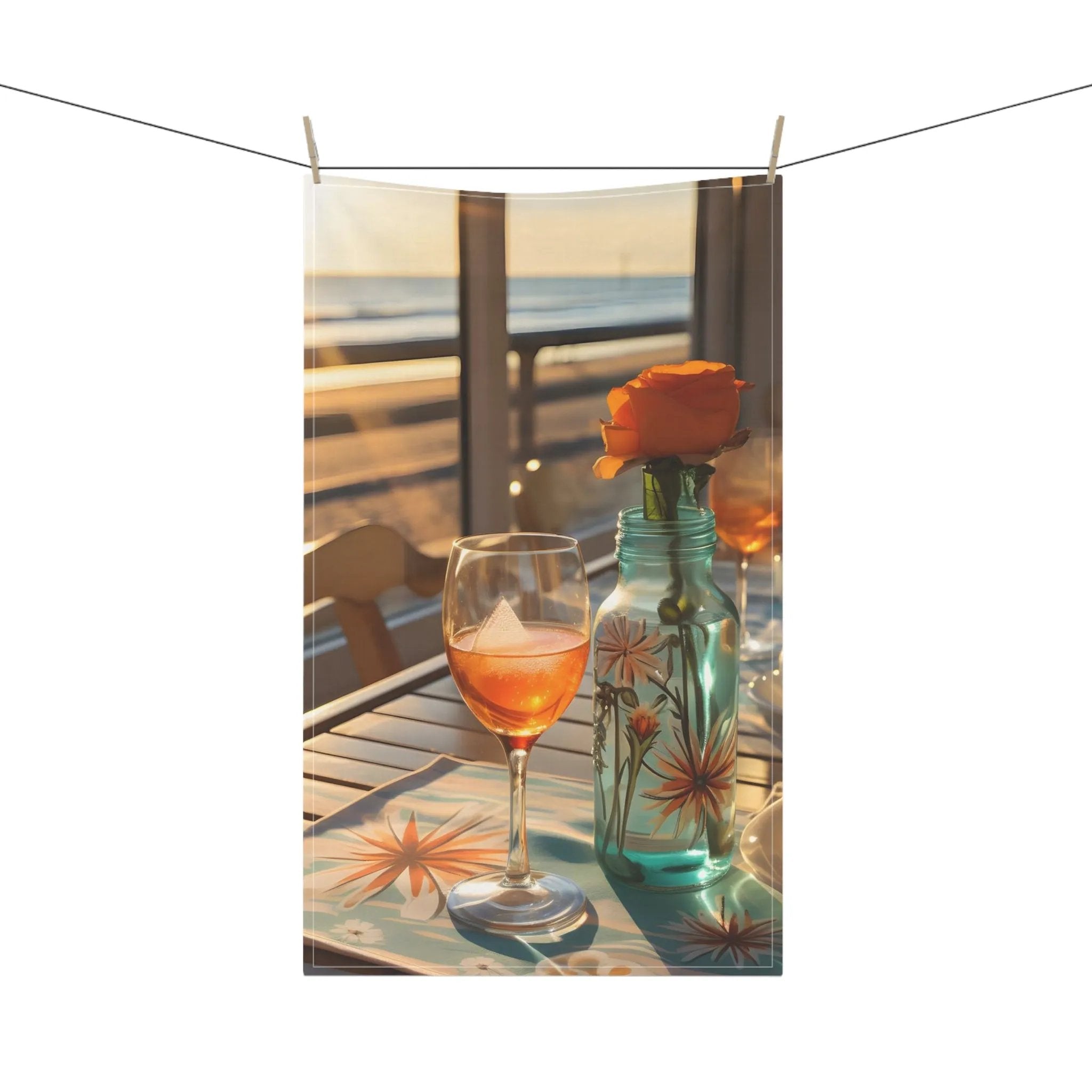 Kitchen Towel | a glass of wine and a vase of flowers on a table