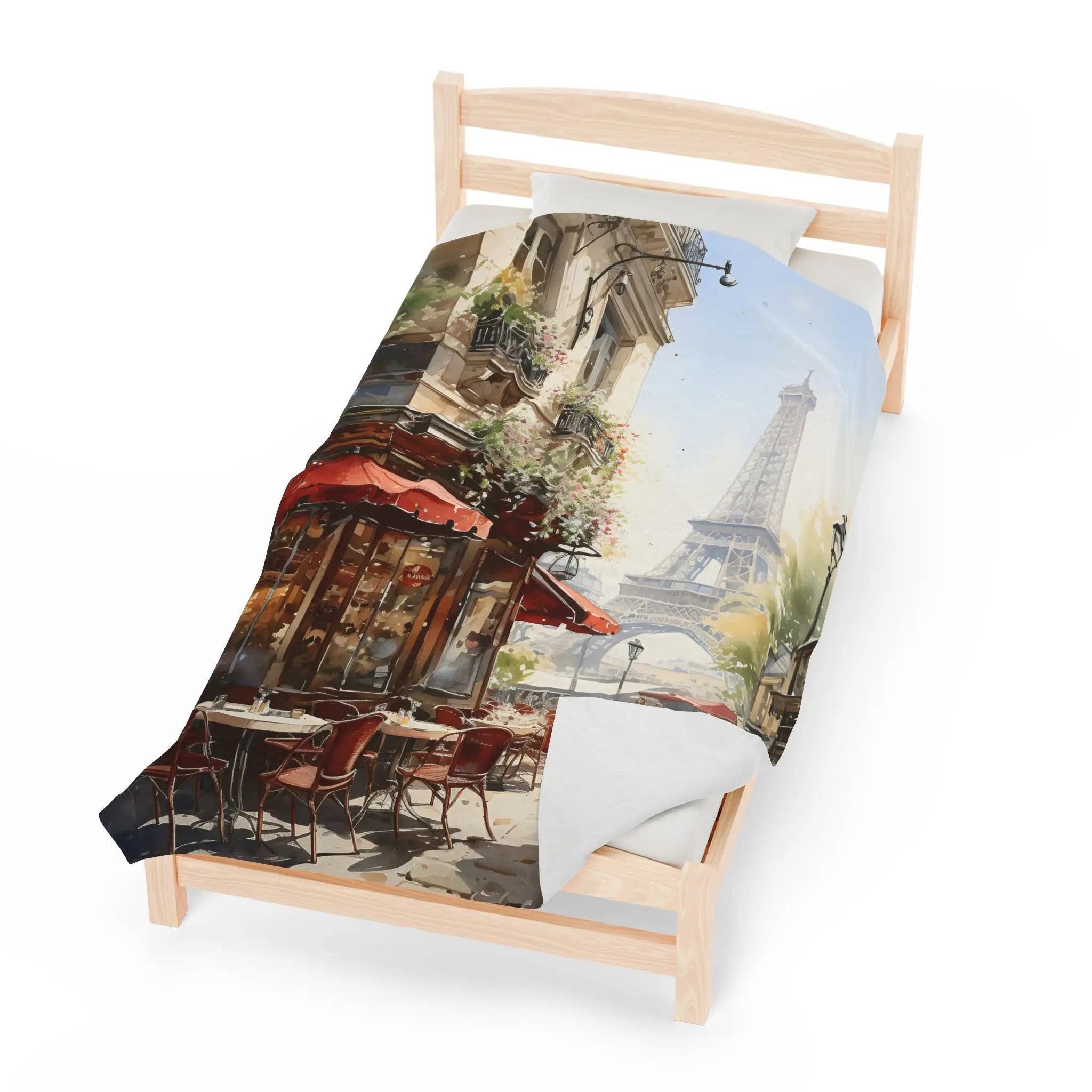 bedroom Blanket | a bed with a picture of the Eiffel tower on it