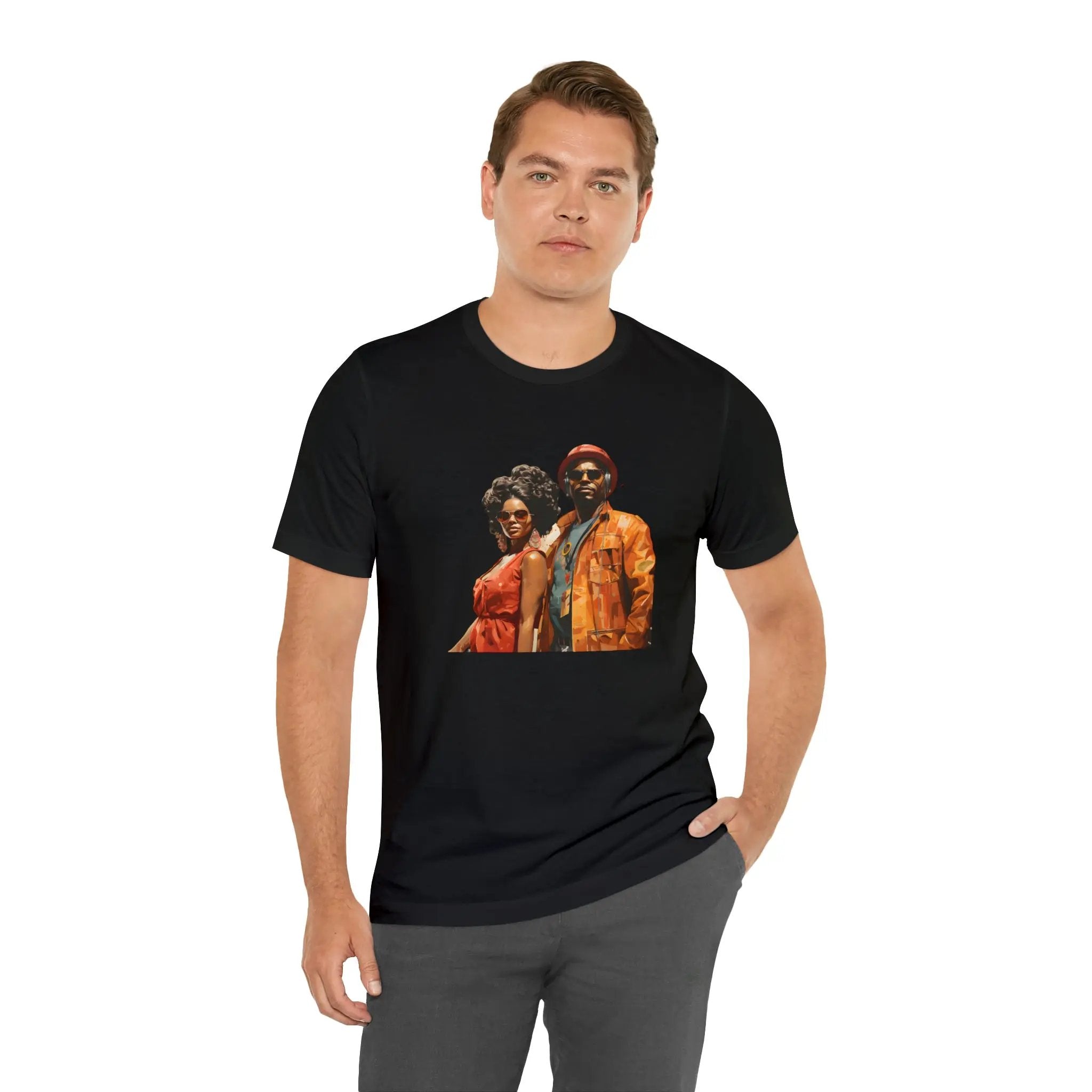 Couple t shirt | a man wearing a black t - shirt with a picture of two people on it