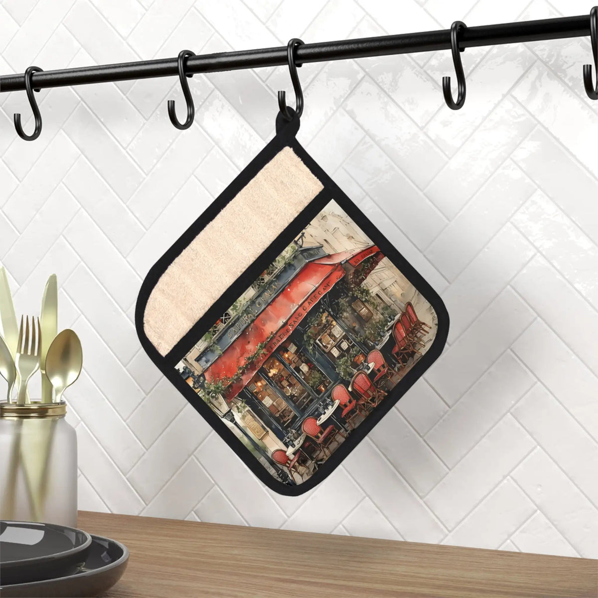 Pot Holder | a pot holder hanging from a metal bar