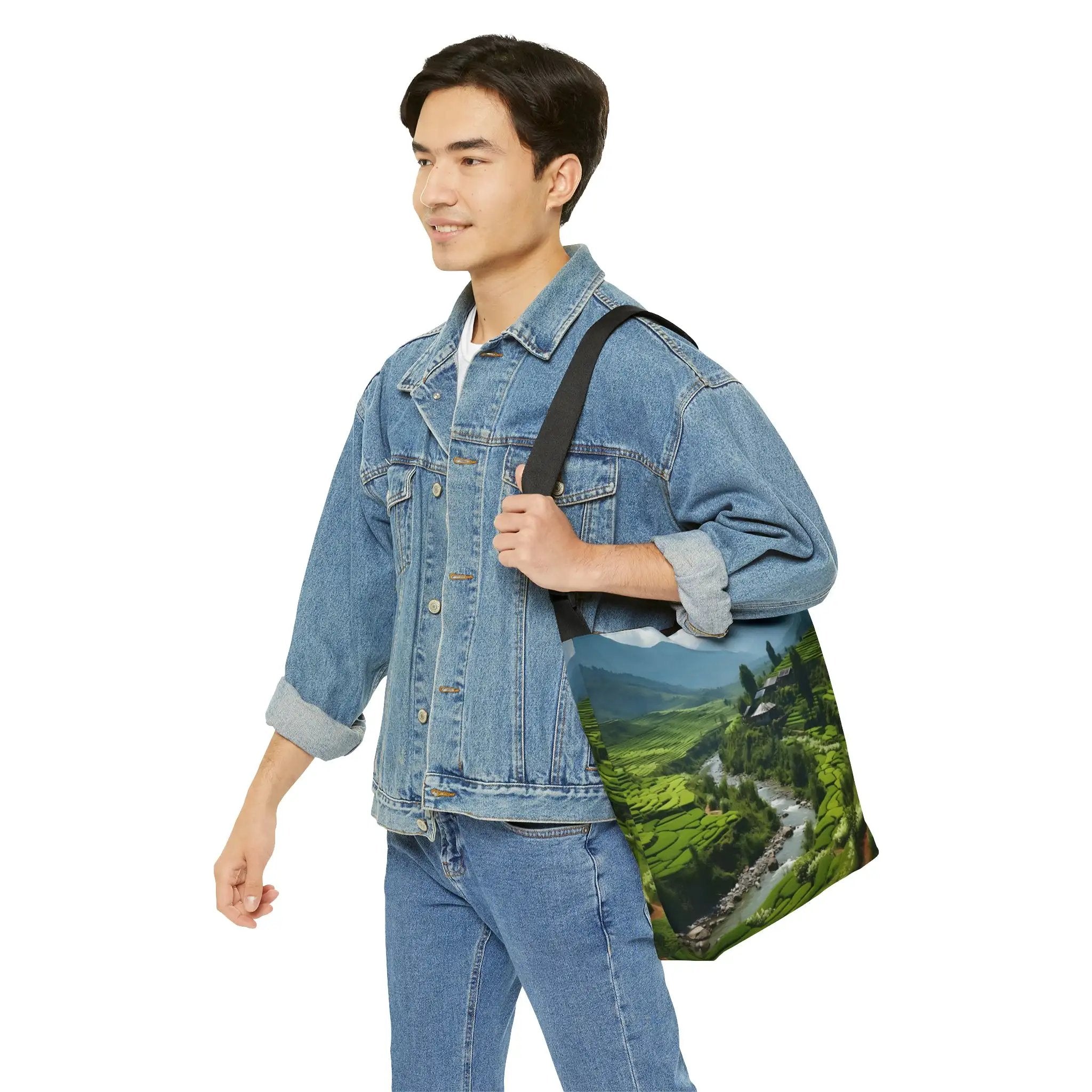 Weekender tote bag | a man in a jean jacket carrying a bag