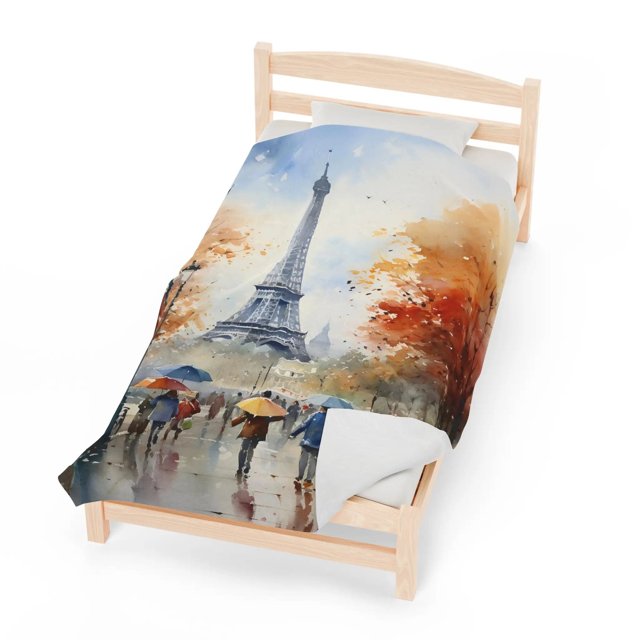 bedroom Blanket | a bed with a painting of the Eiffel tower on it