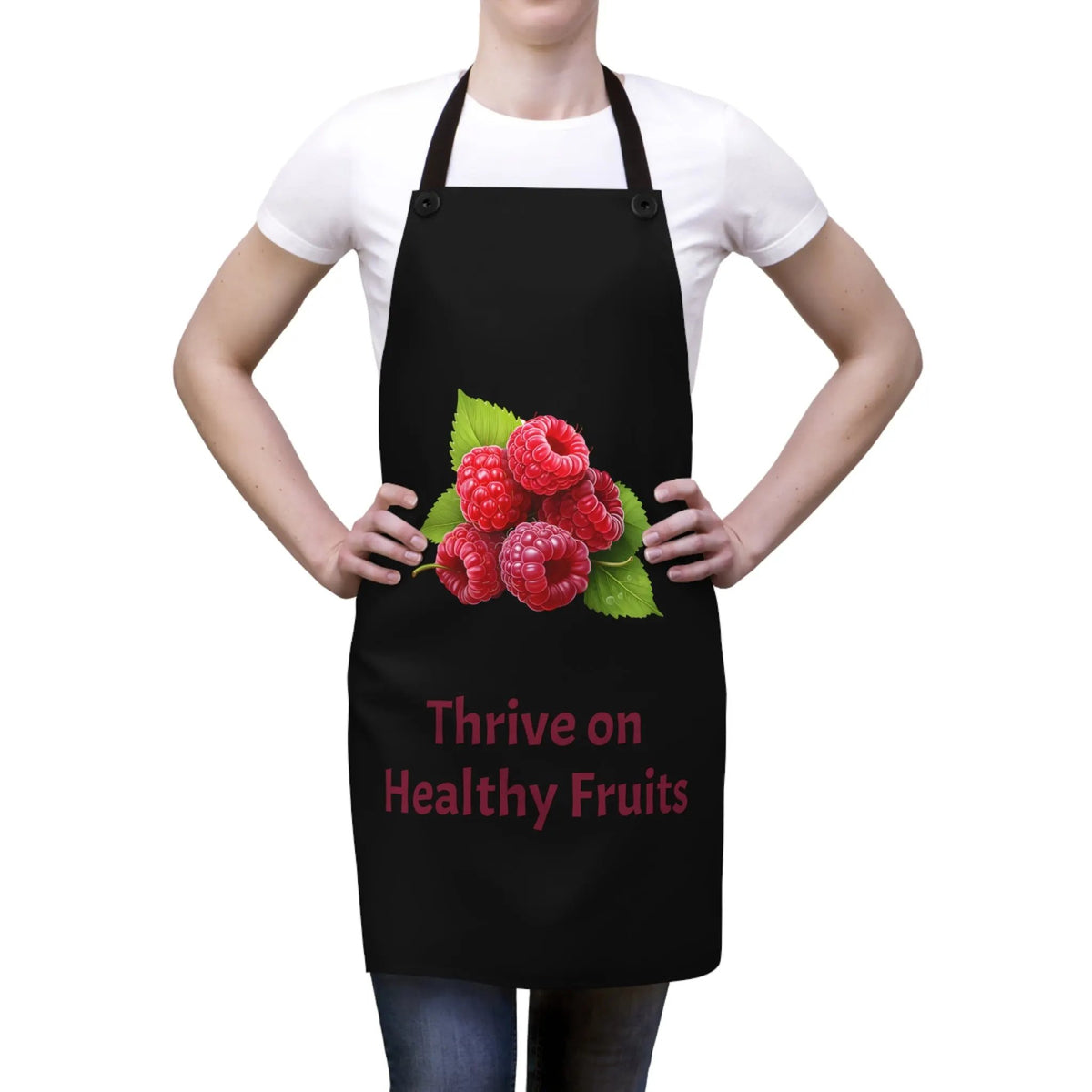 Chef Apron | a woman wearing a black apron with raspberries on it