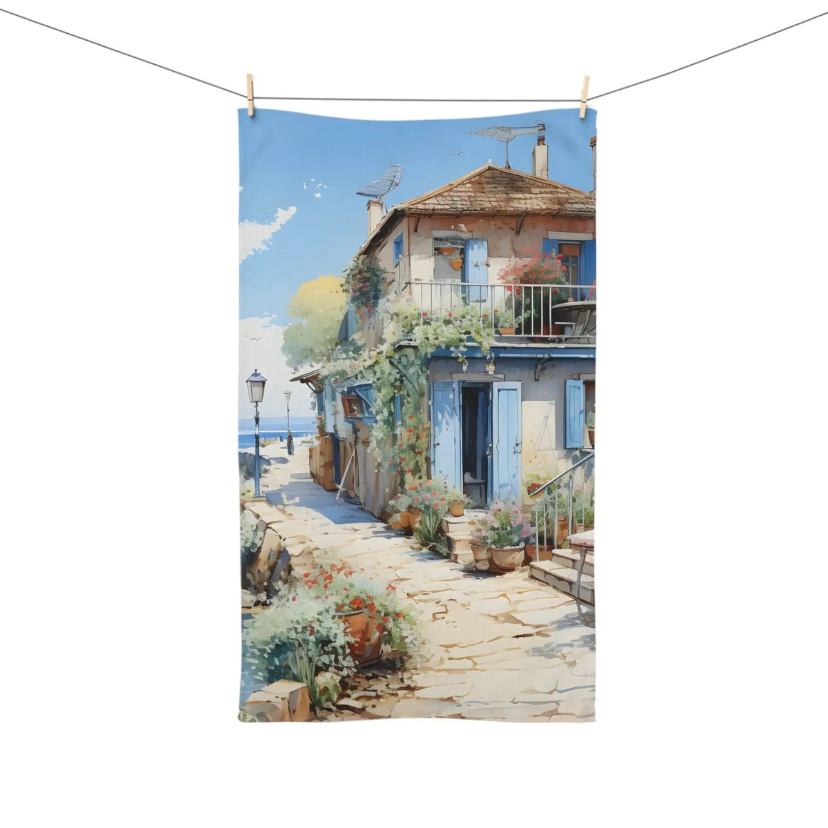 Hand towel | a painting of a house on a clothes line