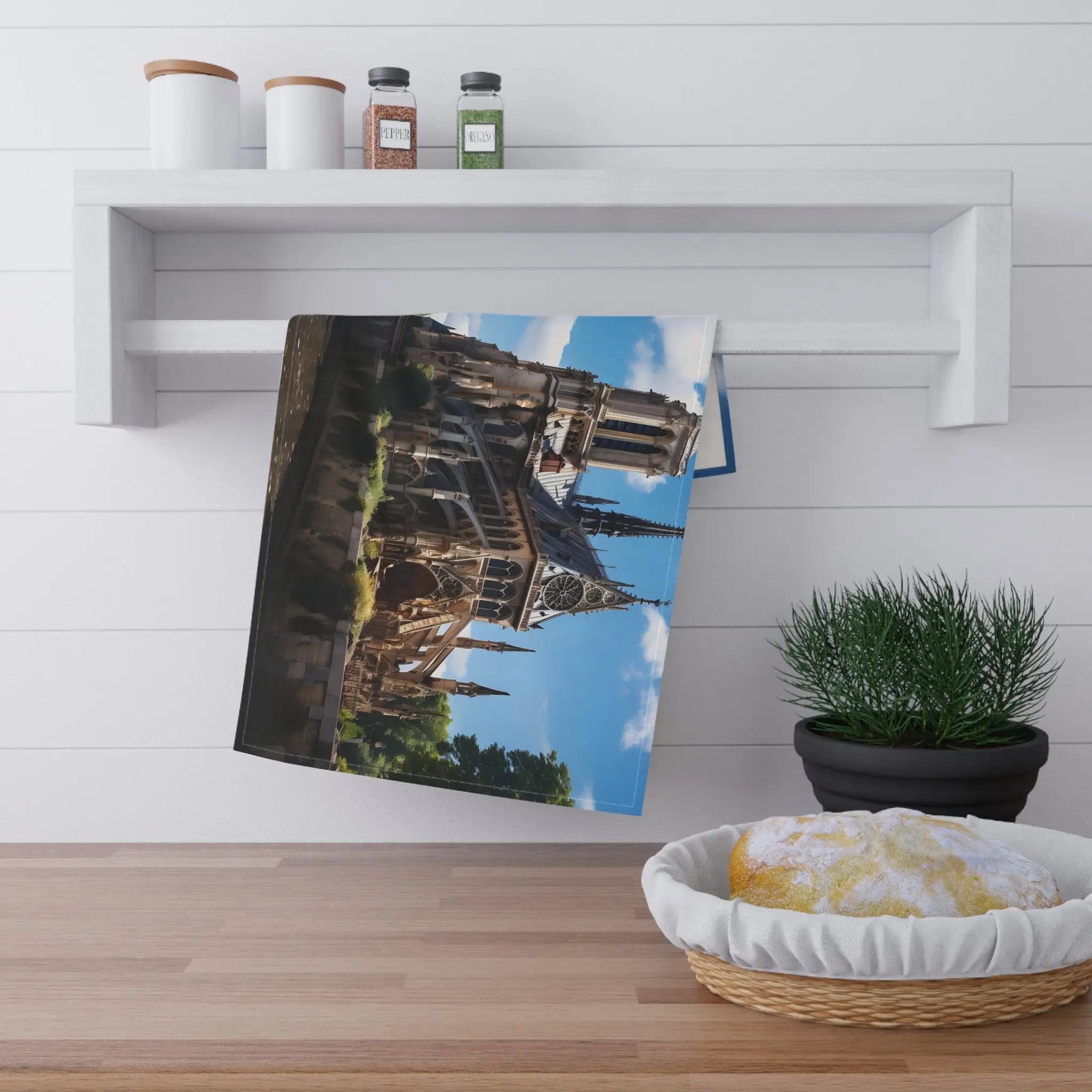 Kitchen Towel | a photo hanging on a wall next to a potted plant