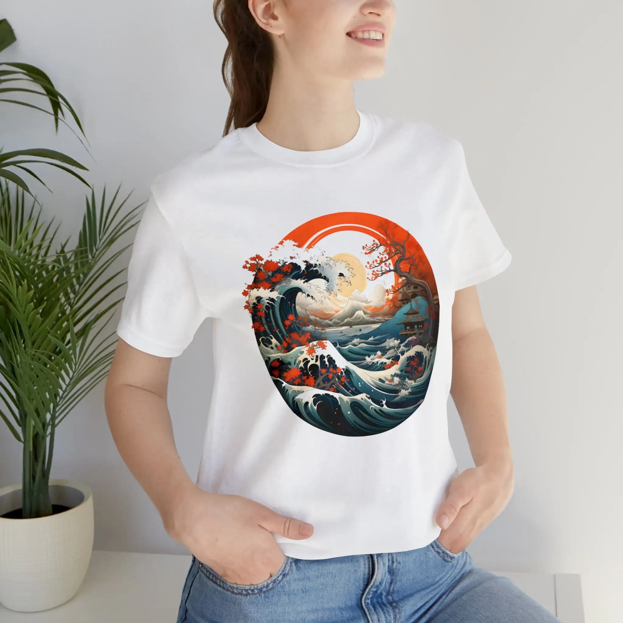 Couple t shirt | a woman wearing a white t - shirt with a painting of a wave