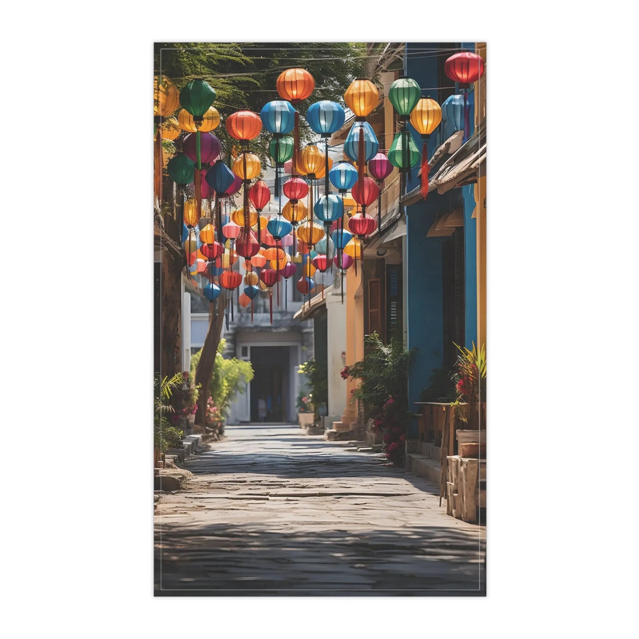 Kitchen Towel | a street lined with colorful lanterns hanging from the side of buildings