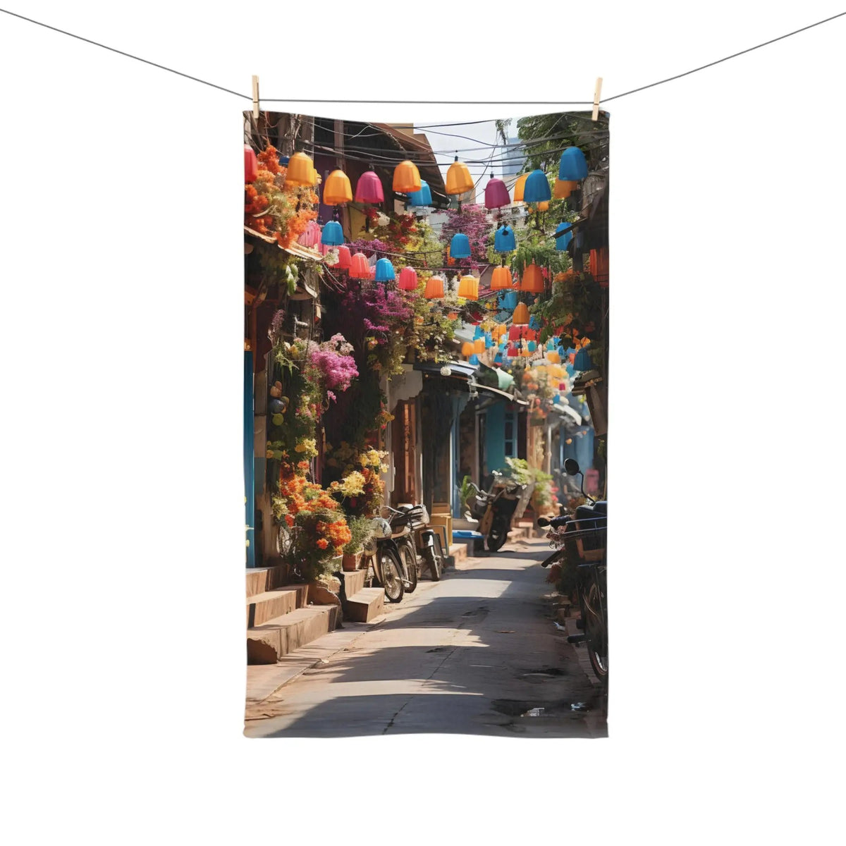 Hand Towel | a street with a bunch of colorful lights hanging from it's sides