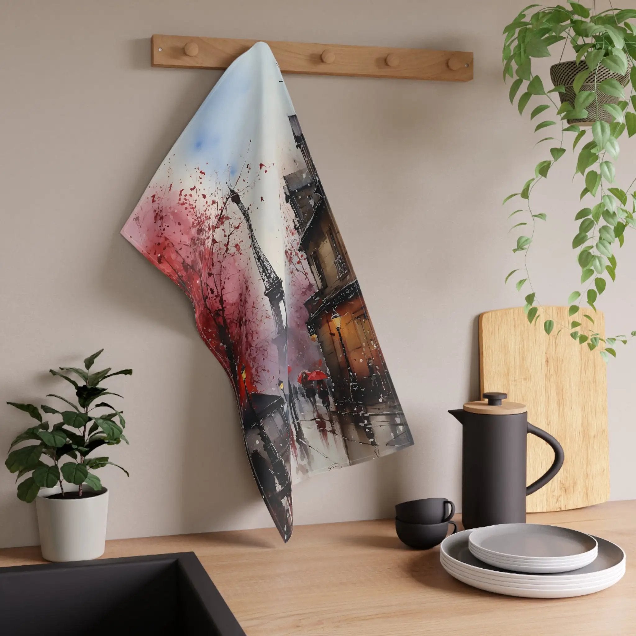 Kitchen Towel | a tea towel hanging on a wall next to a potted plant