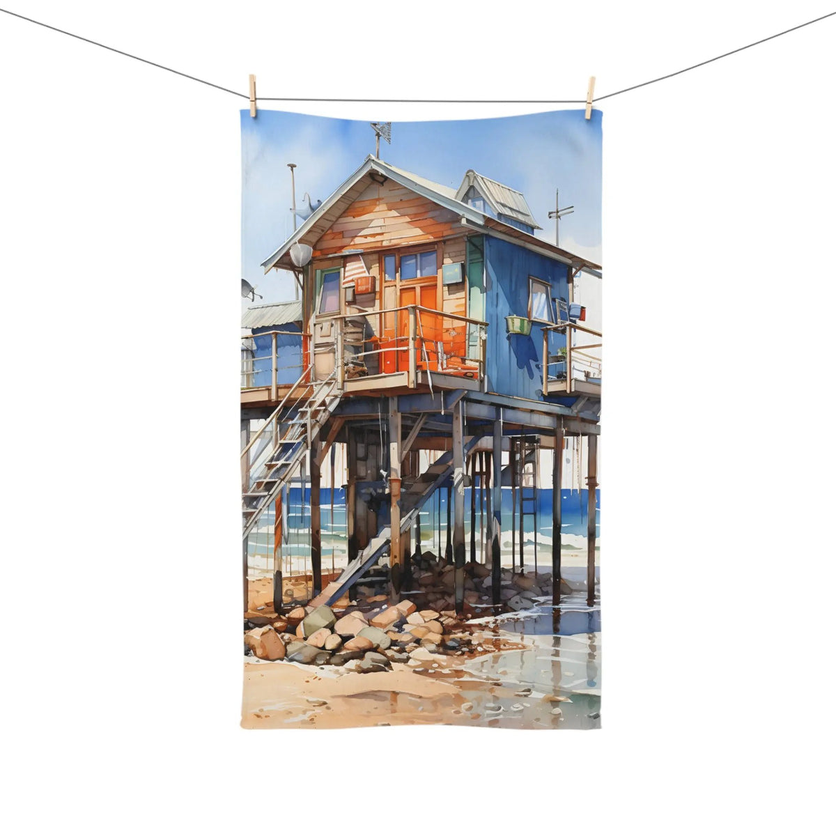 Hand towel | a painting of a house on a beach