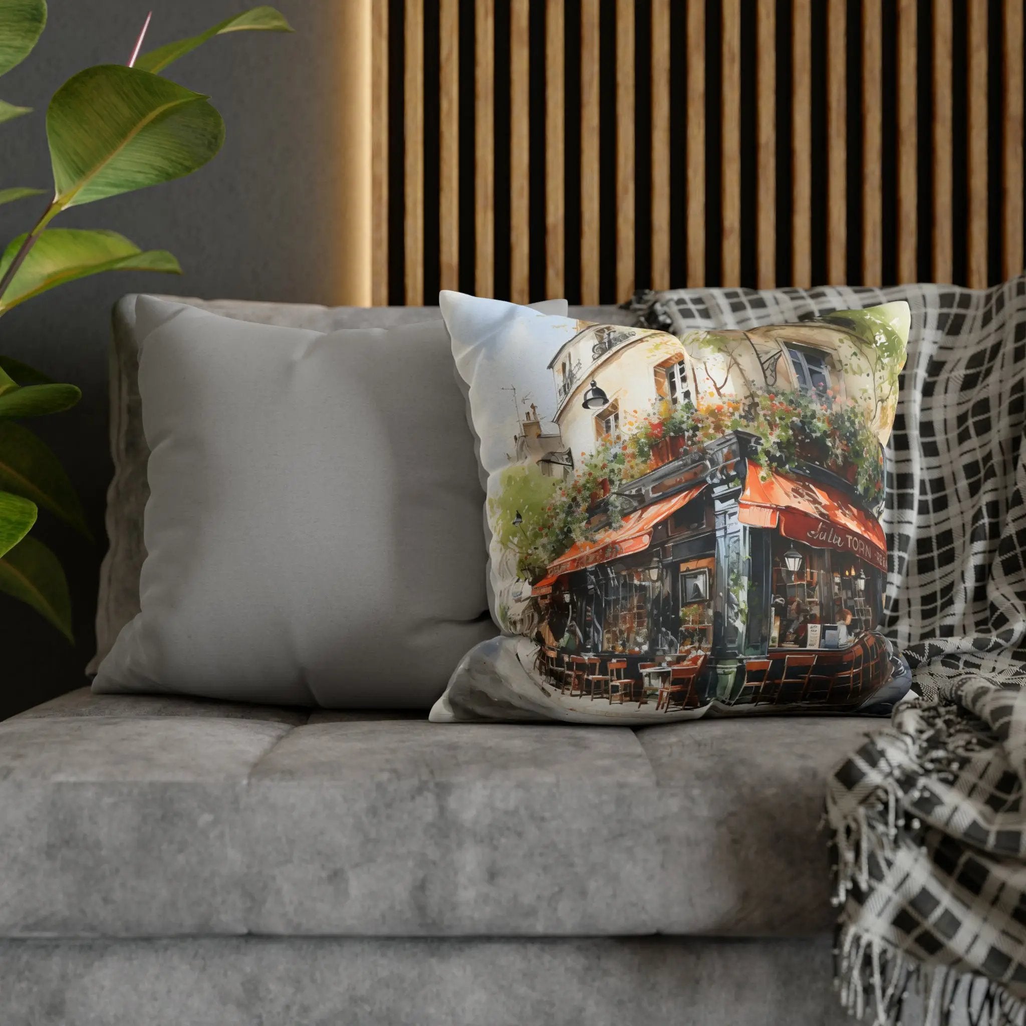 pillow cover | a couch with two pillows on it and a potted plant