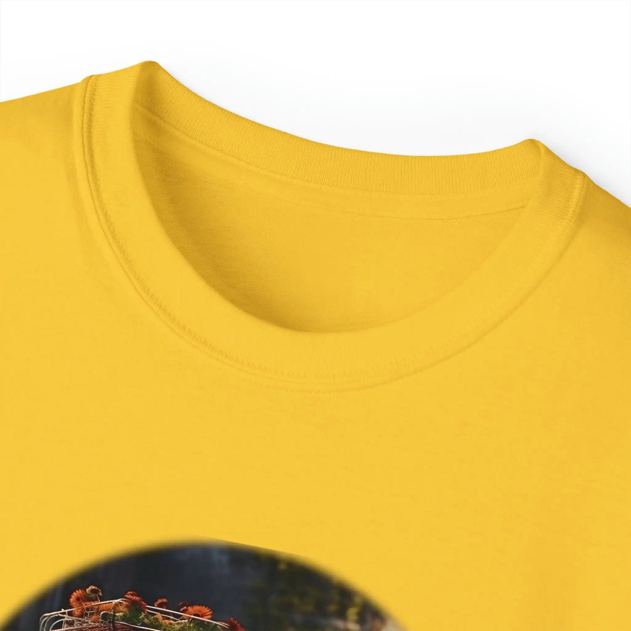 men tee graphic | a yellow t - shirt with a picture of a bird in a cage