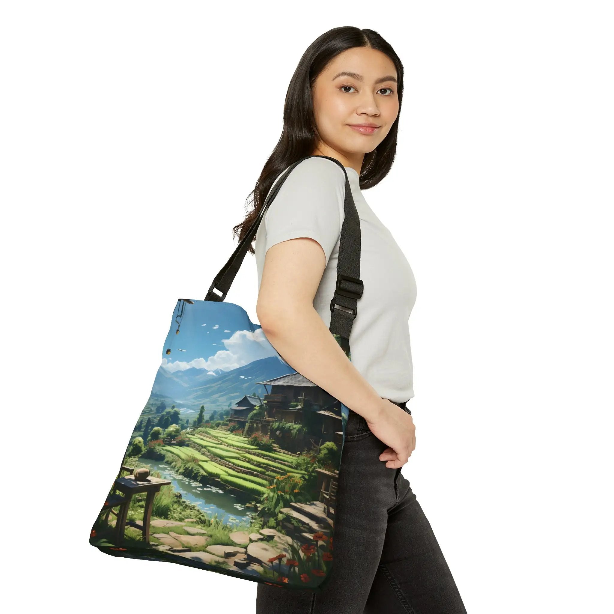 Weekender tote bag | a woman carrying a bag with a painting on it