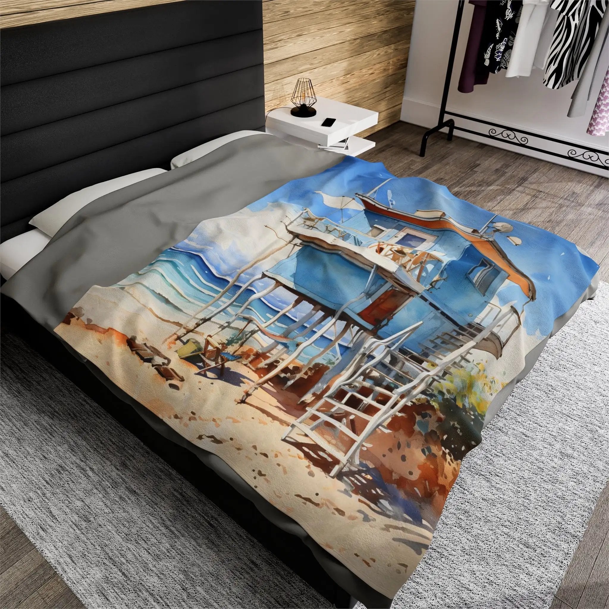 bedroom Blanket | a bed with a picture of a beach cabin on it