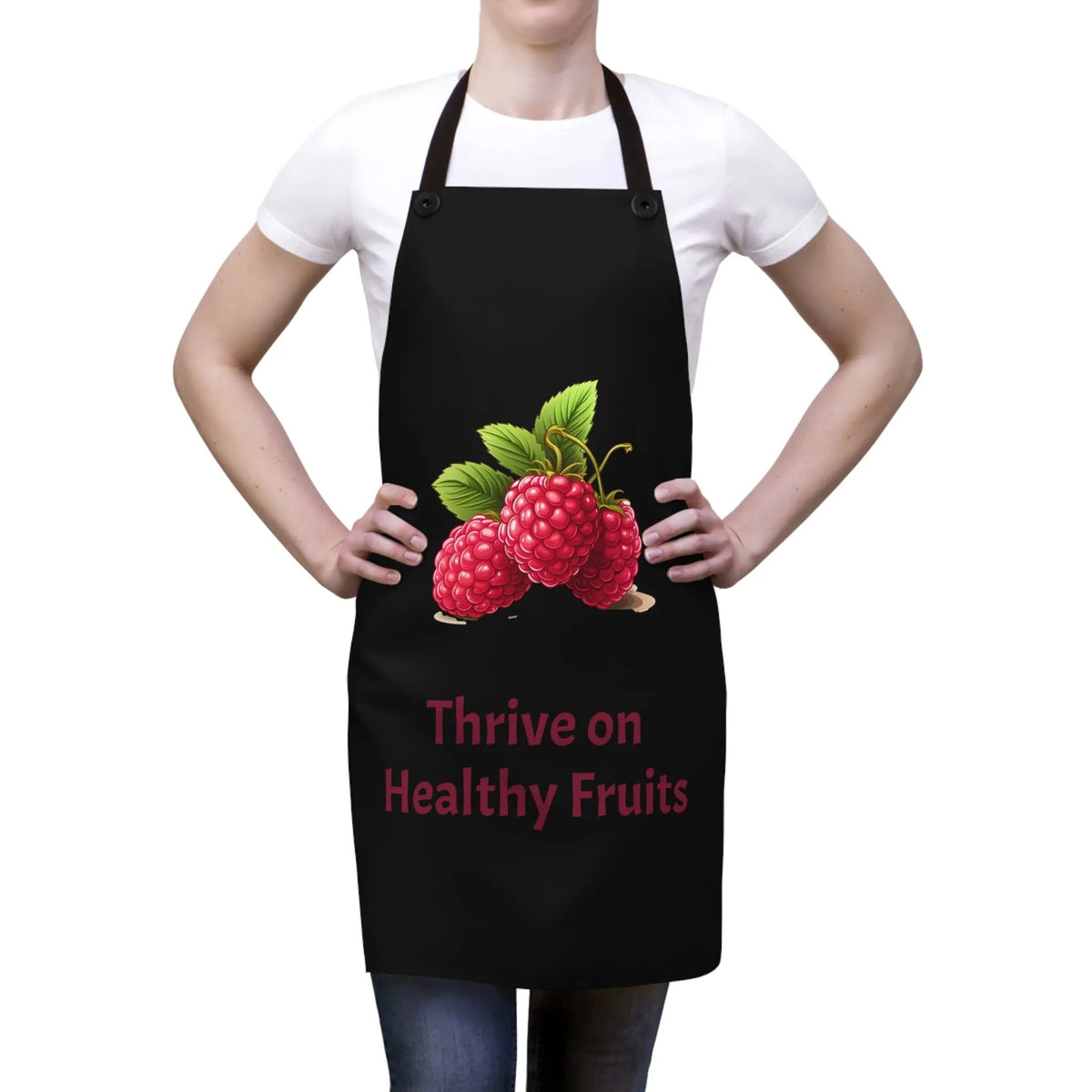 Chef Apron | a woman wearing a black apron with raspberries on it