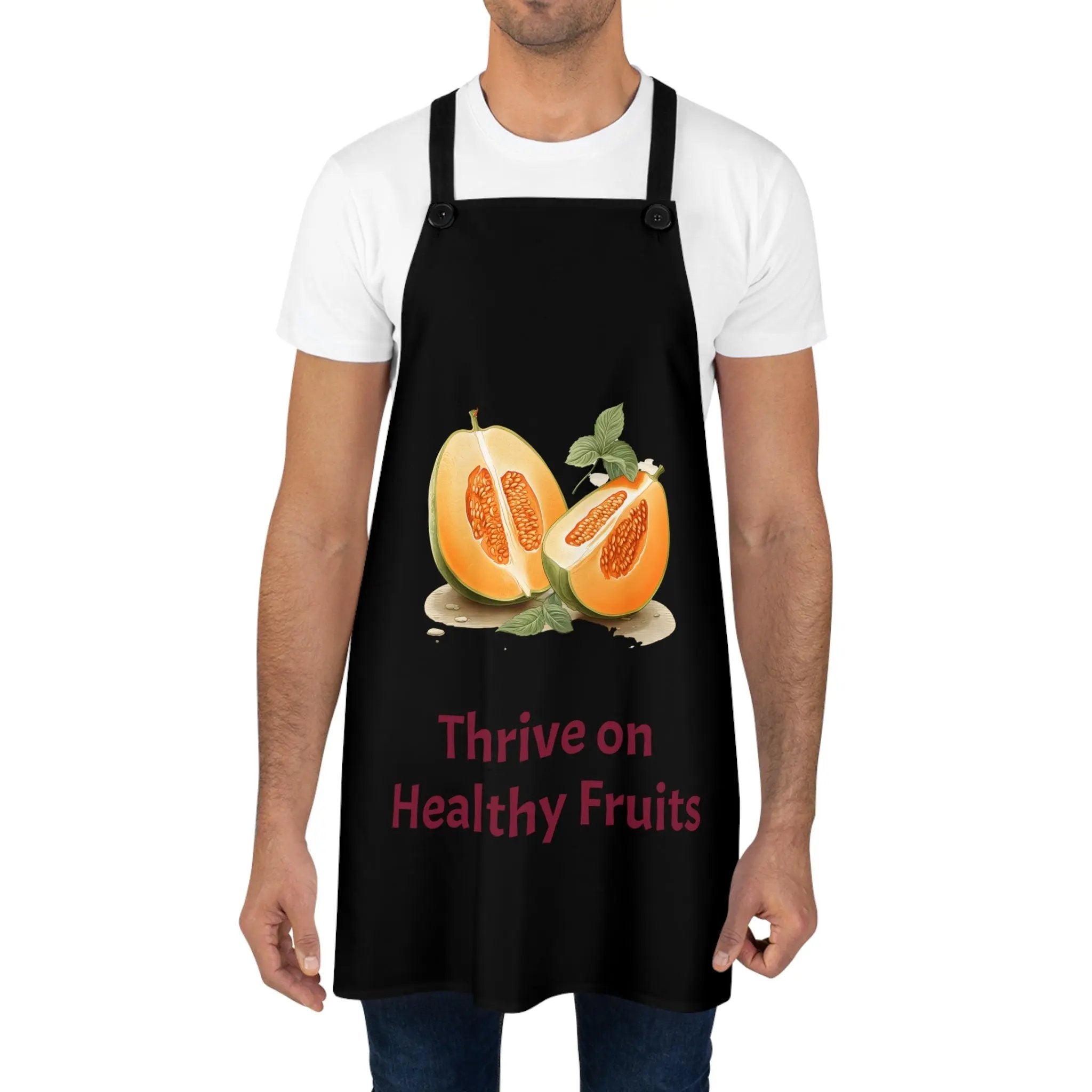 Chef Apron | a man wearing a black apron with two halves of fruit on it